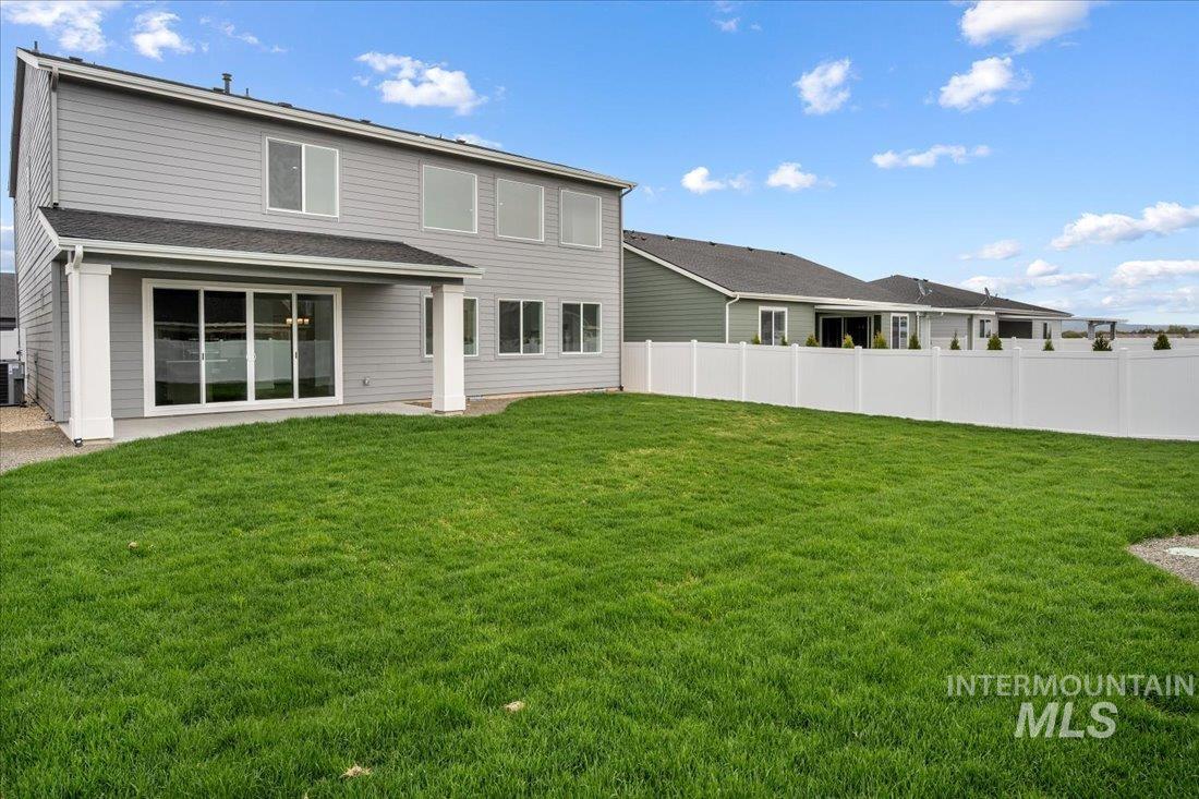 Rear view of property featuring a patio area
