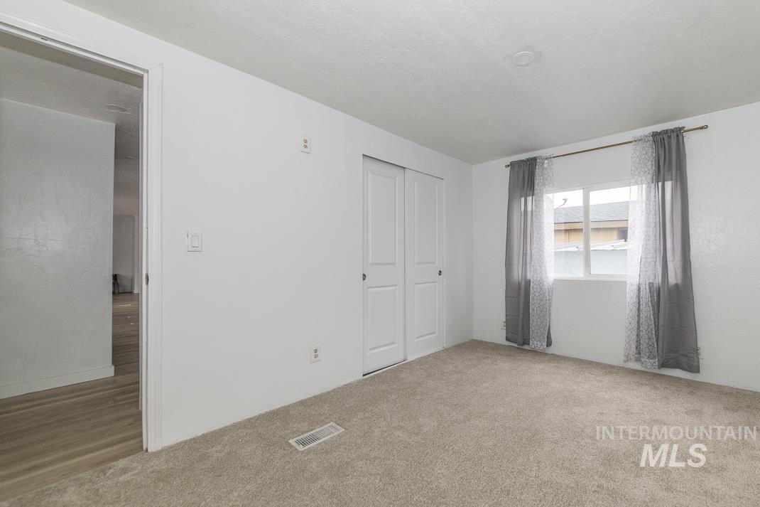 Unfurnished bedroom with carpet floors and a closet
