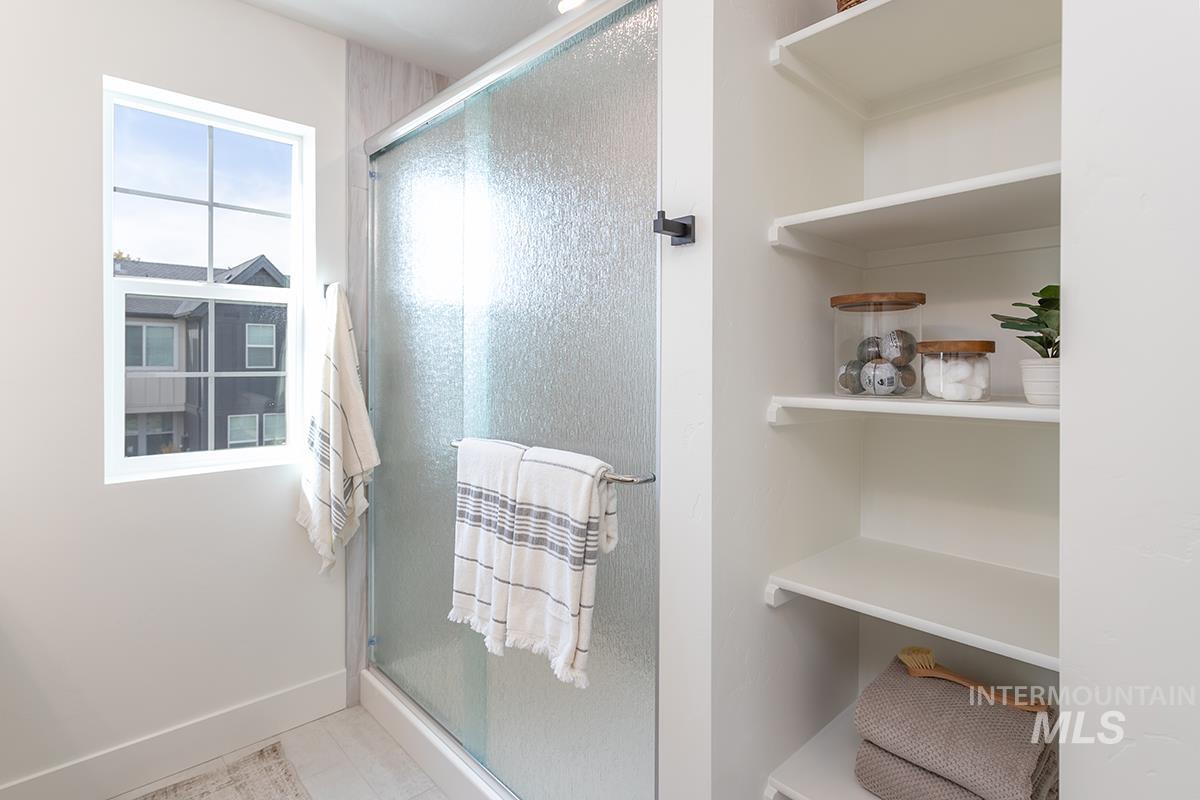 Full bathroom featuring a stall shower