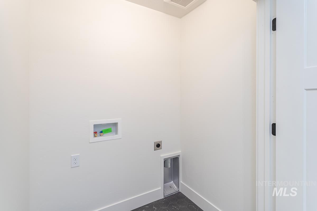 Laundry room featuring hookup for a washing machine and hookup for an electric dryer
