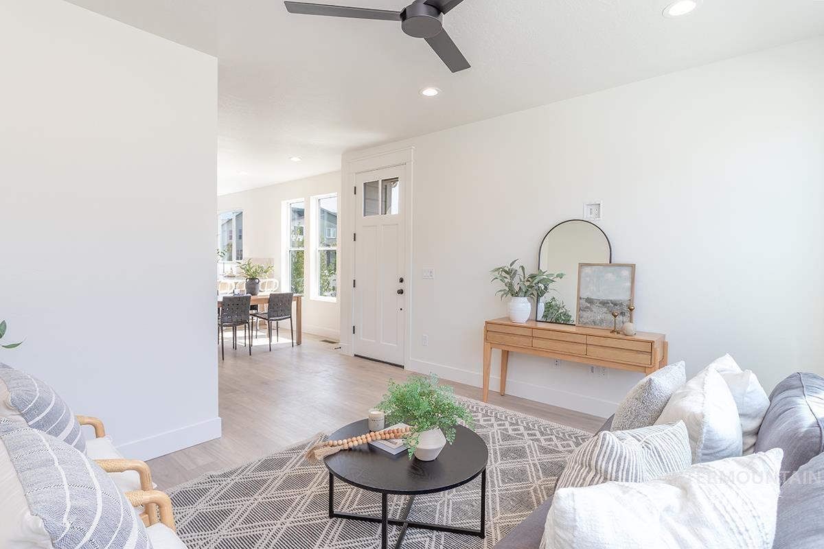 Living room featuring wood finished floors, recessed lighting, and a ceiling fan