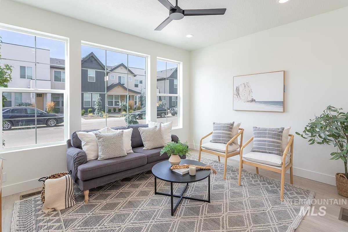 Sitting room with recessed lighting and ceiling fan