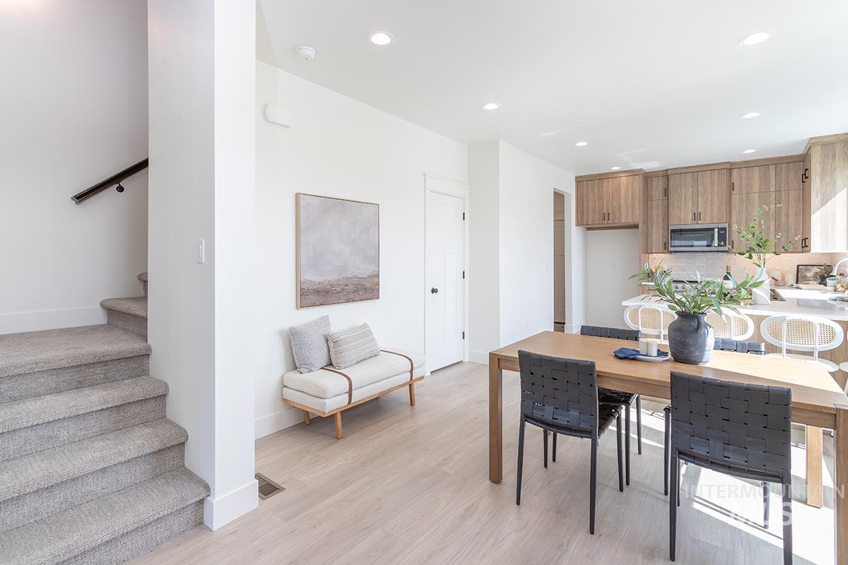 Dining space featuring stairs, recessed lighting, and light wood finished floors