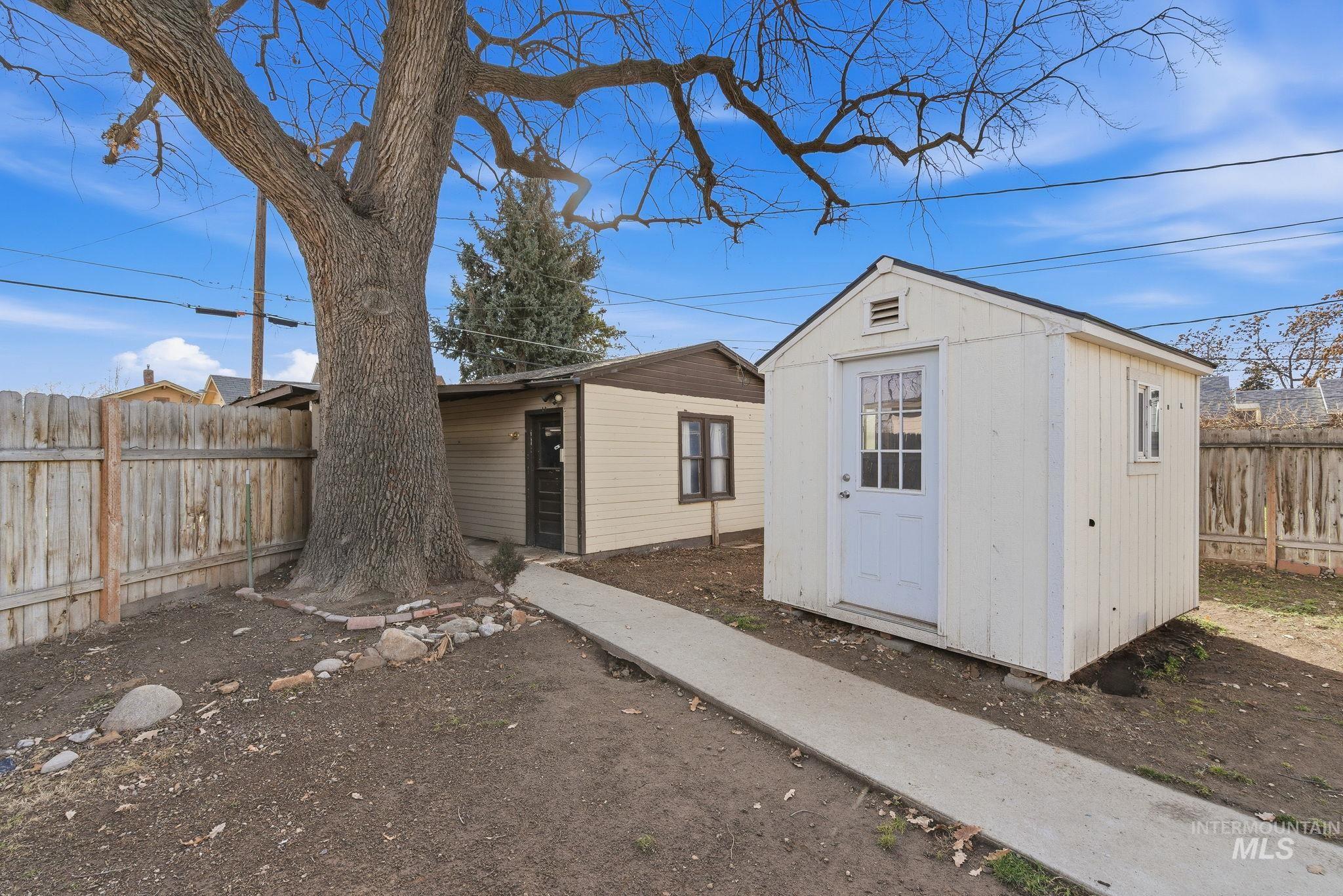 View of shed featuring a fenced backyard