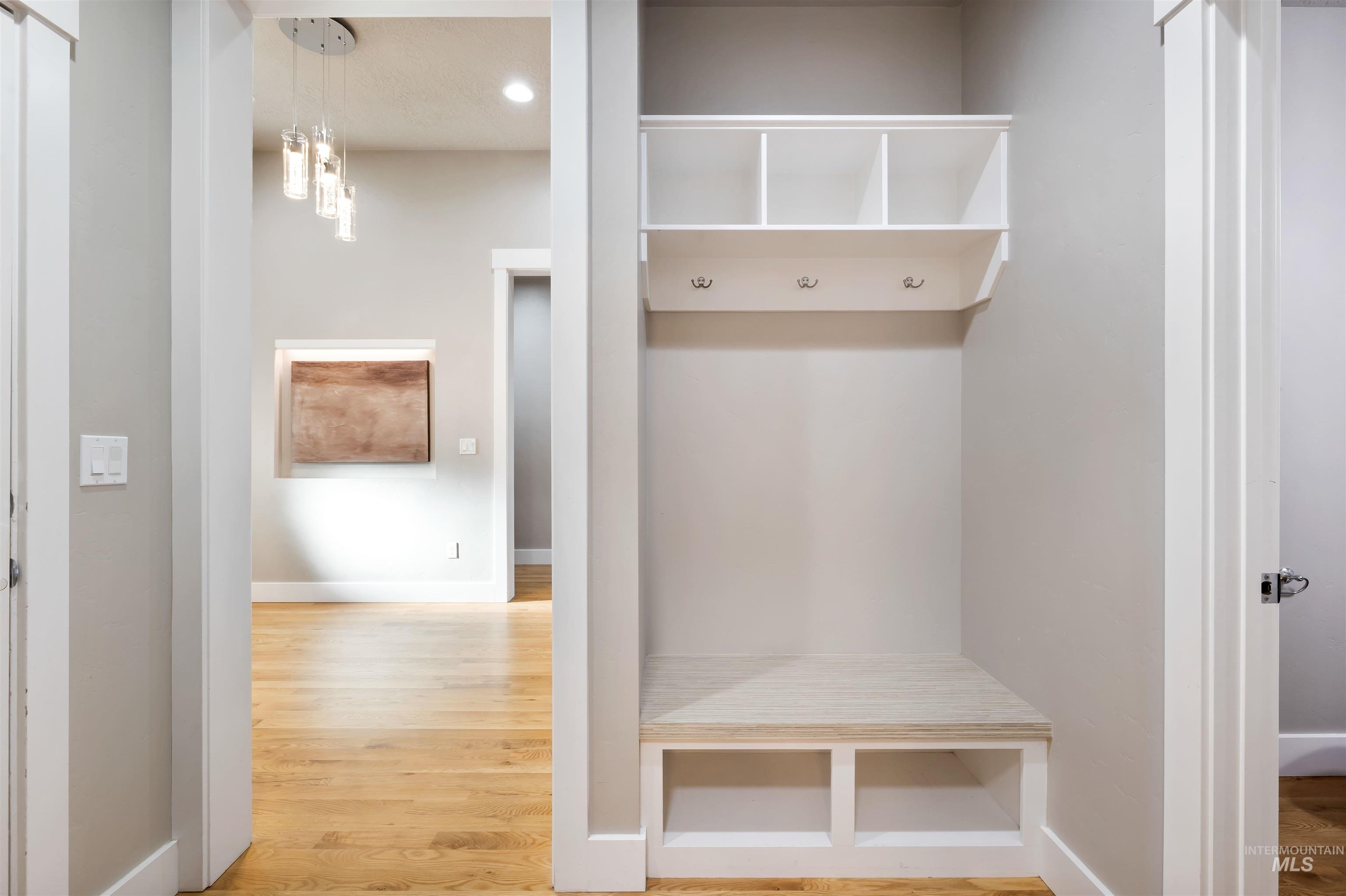 Mudroom with light wood-style floors