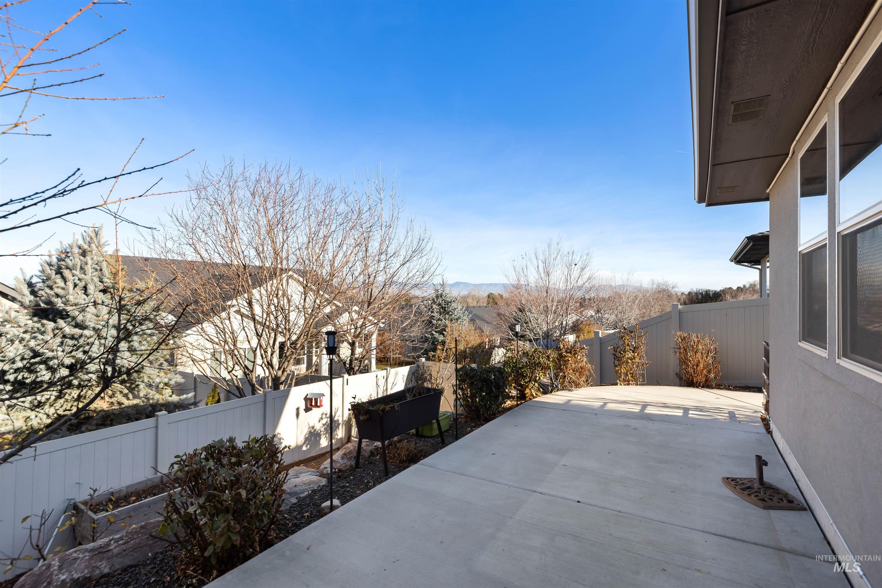 Fenced backyard with a patio area
