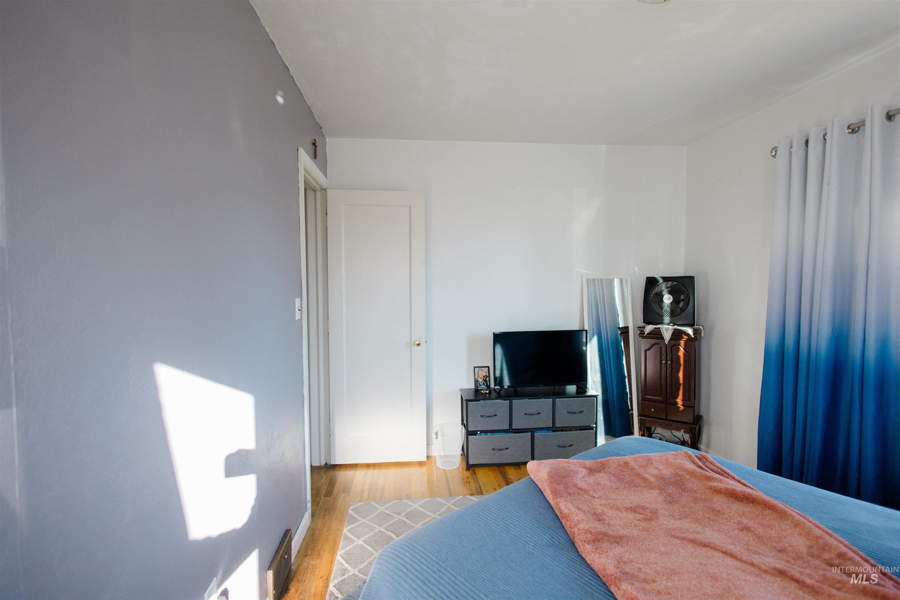Bedroom with wood finished floors