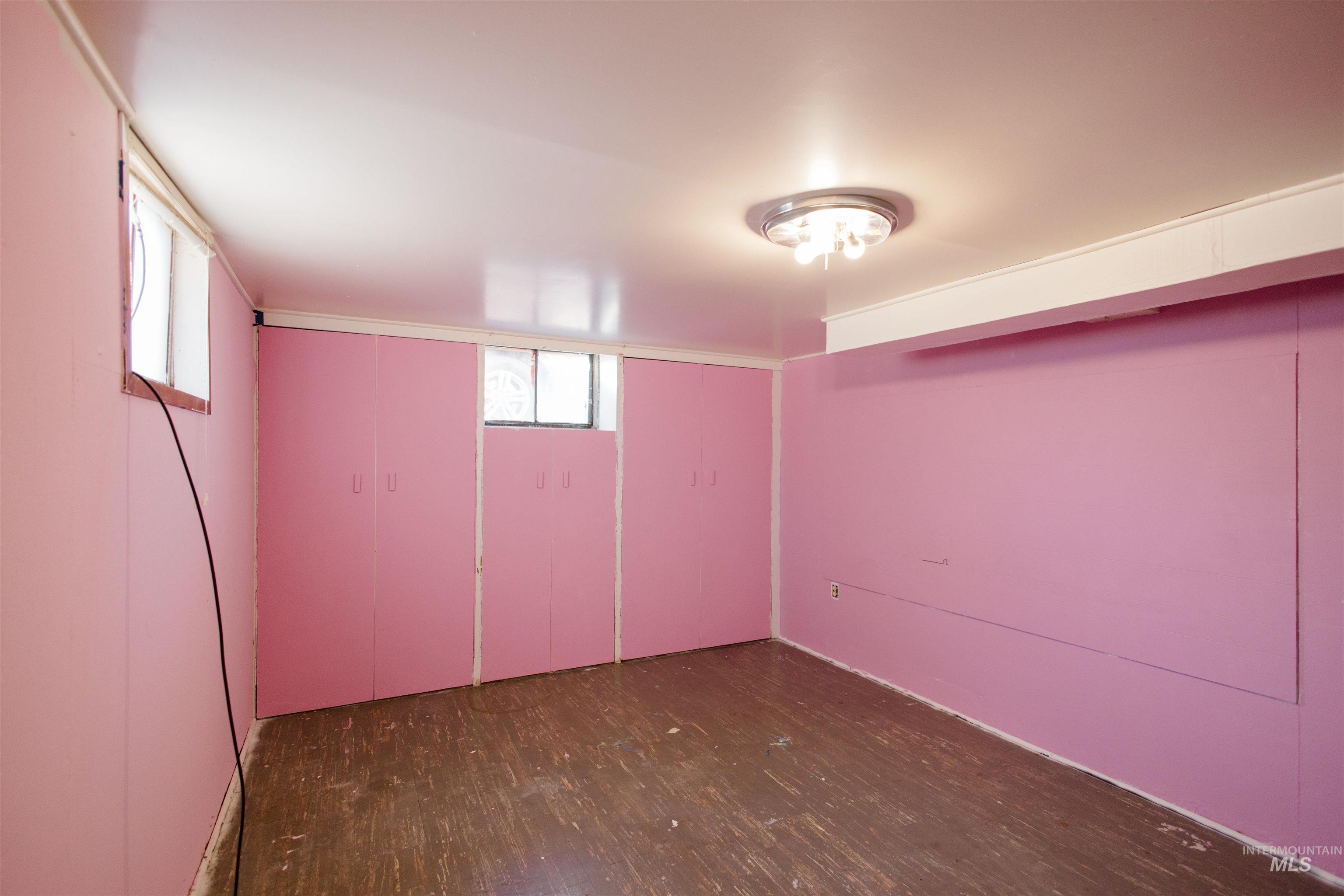 Below grade area with dark wood-style flooring