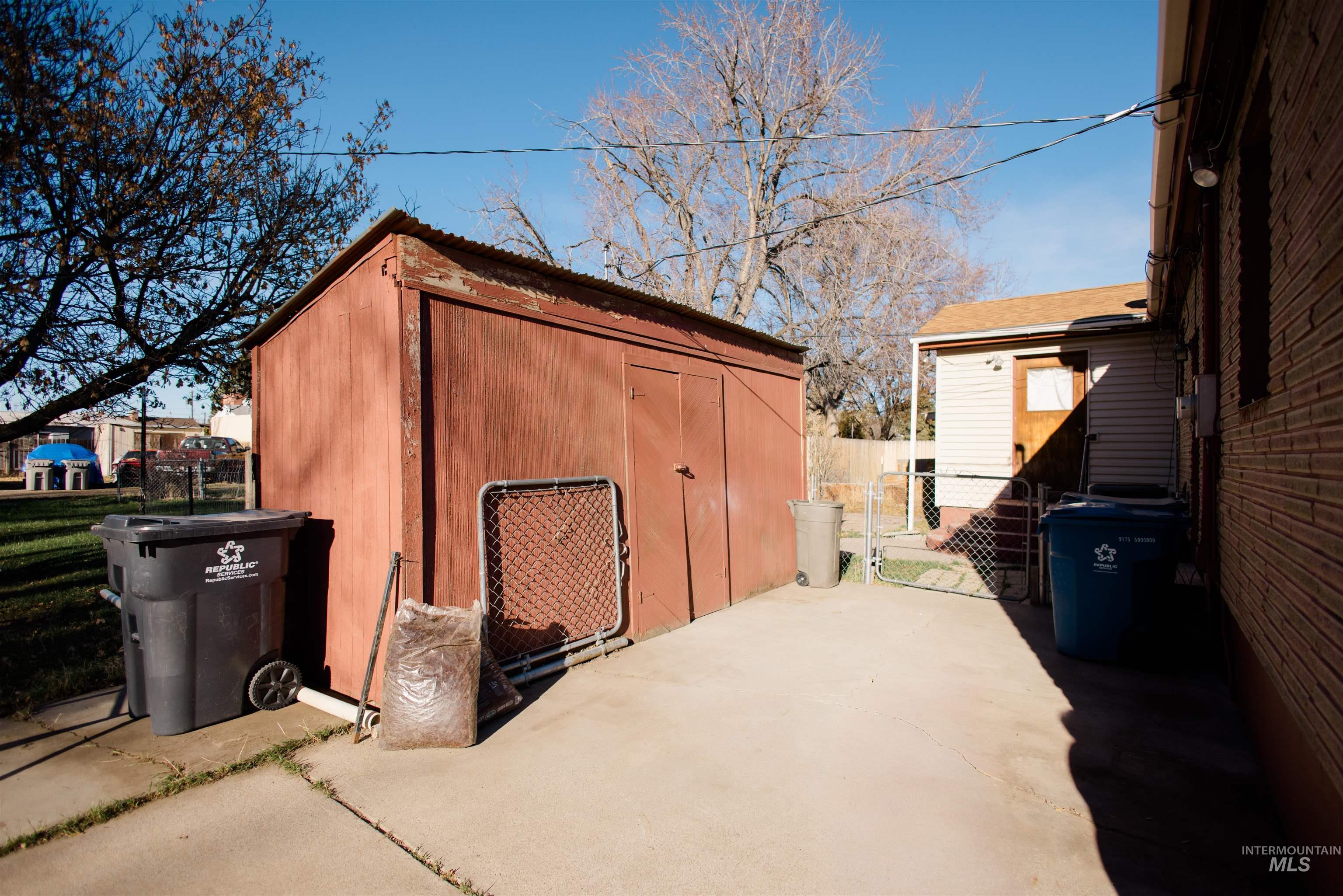 View of shed featuring a gate