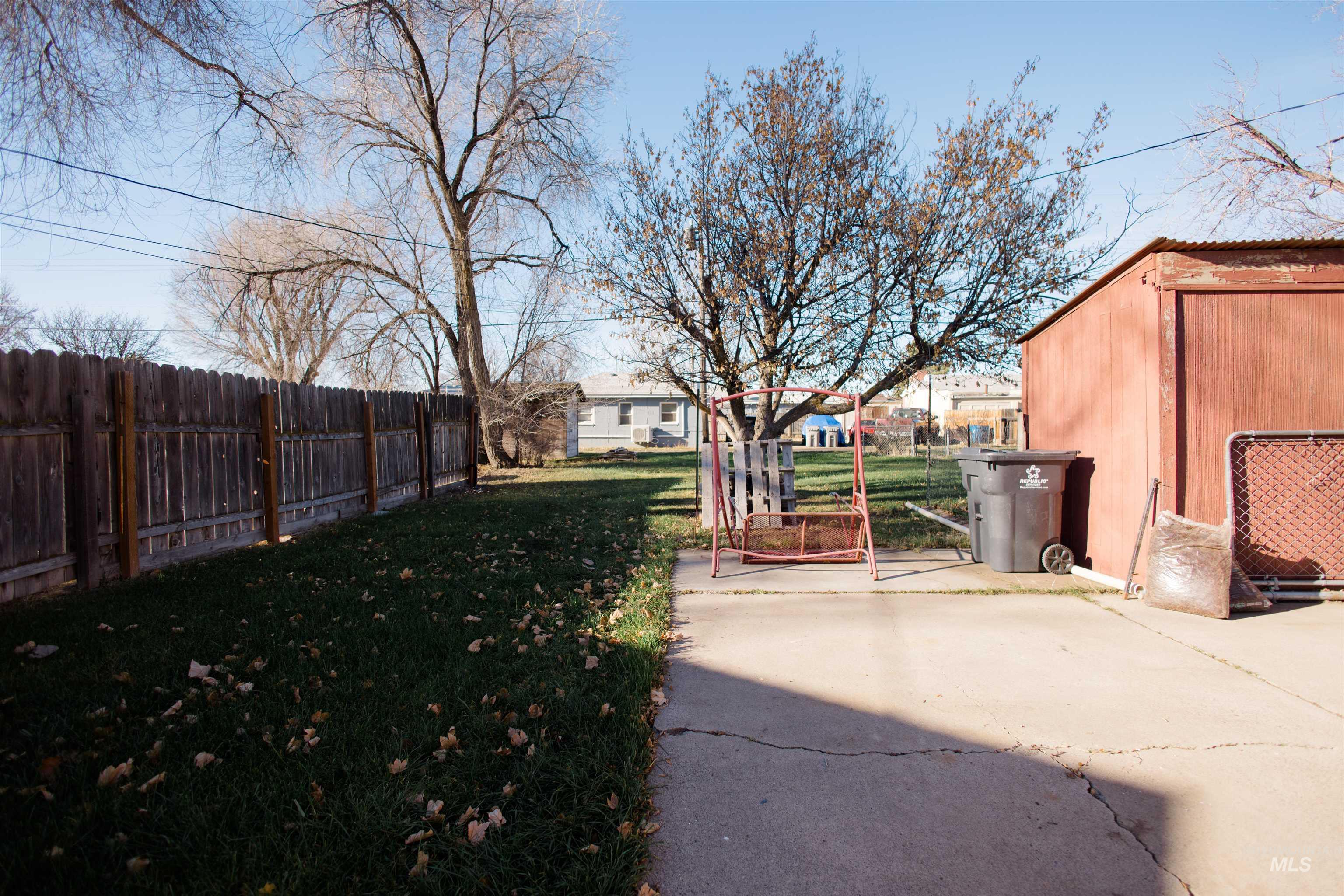 View of fenced backyard