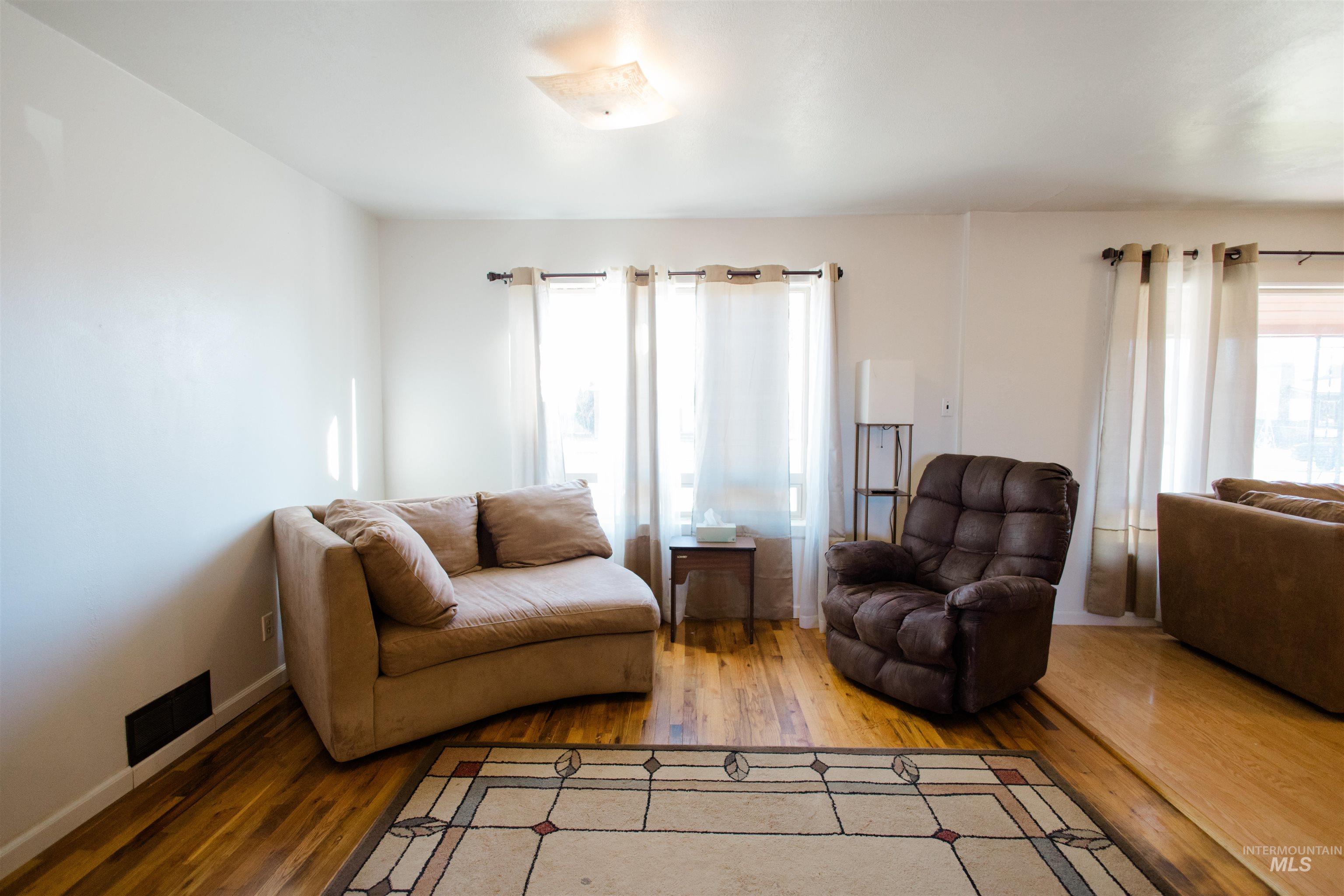 Living room featuring hardwood / wood-style flooring