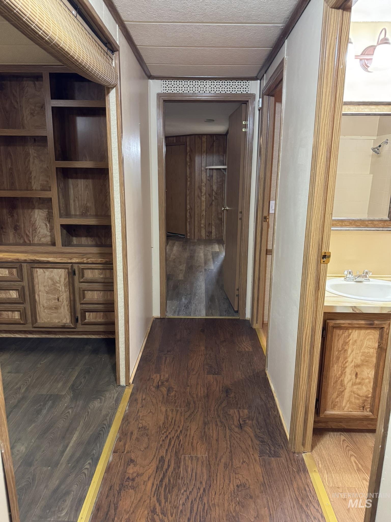 Hall featuring dark wood-style floors