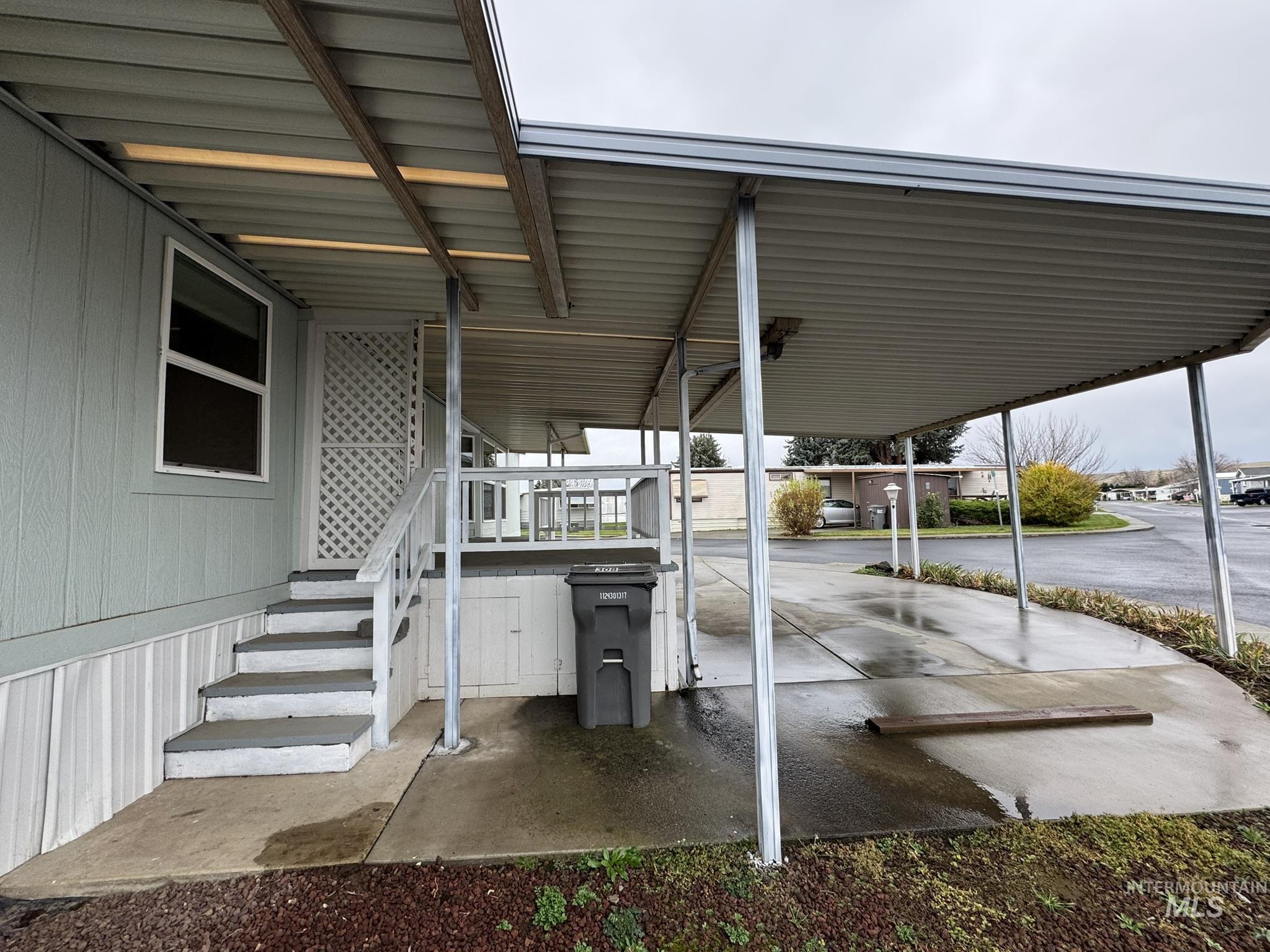 View of patio / terrace featuring an attached carport