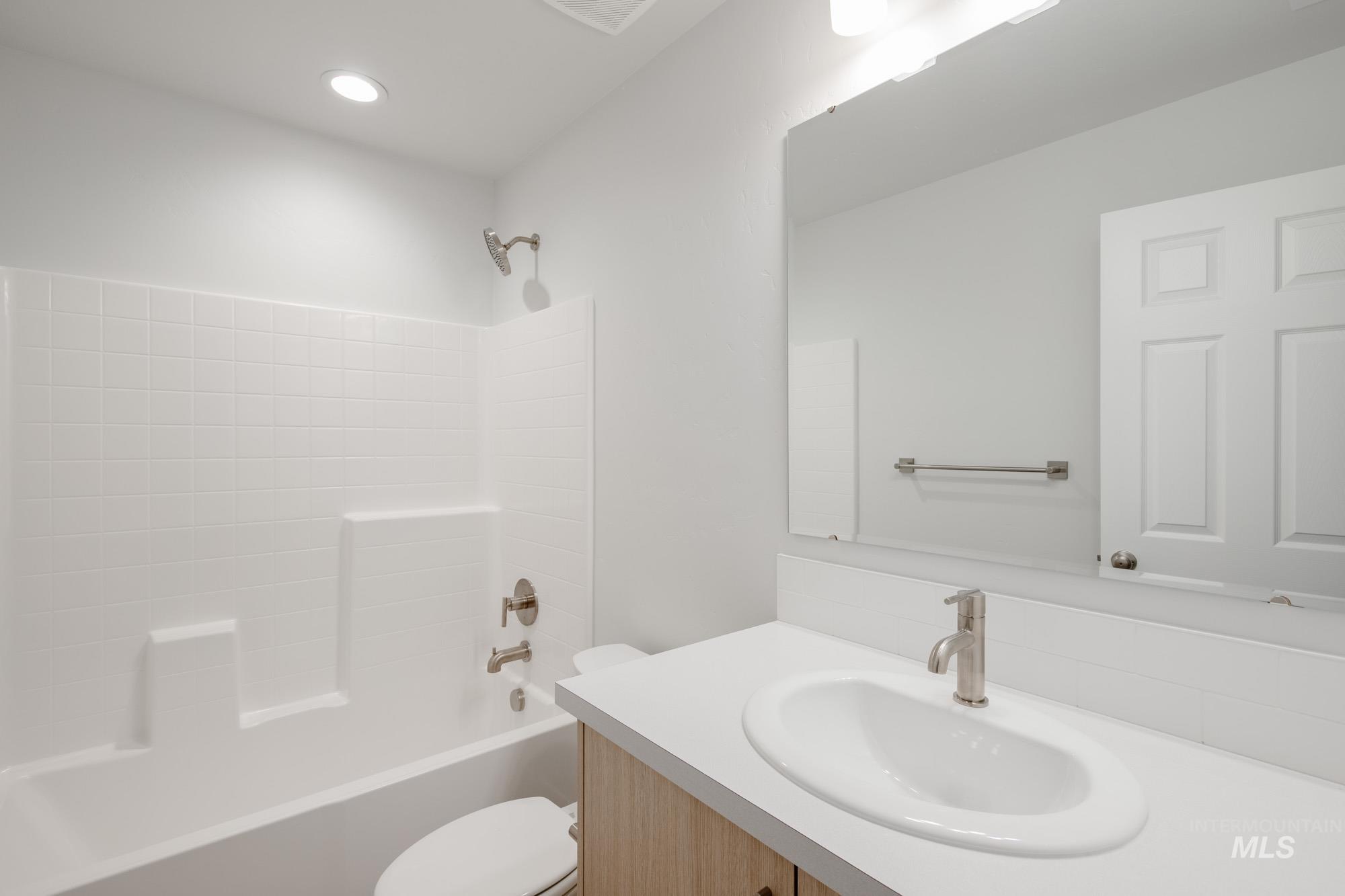 Full bath featuring bathtub / shower combination and vanity