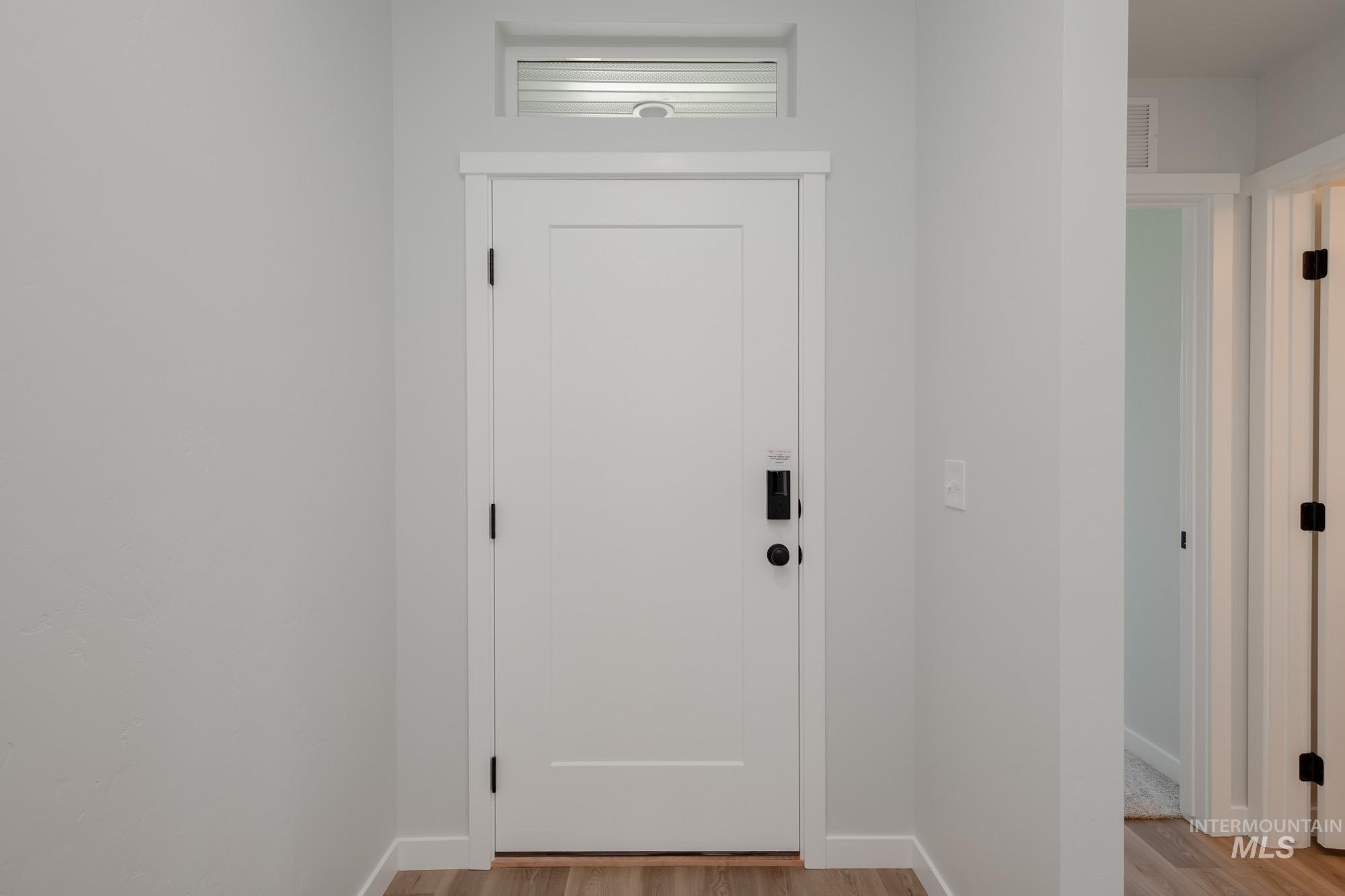 Doorway with wood finished floors