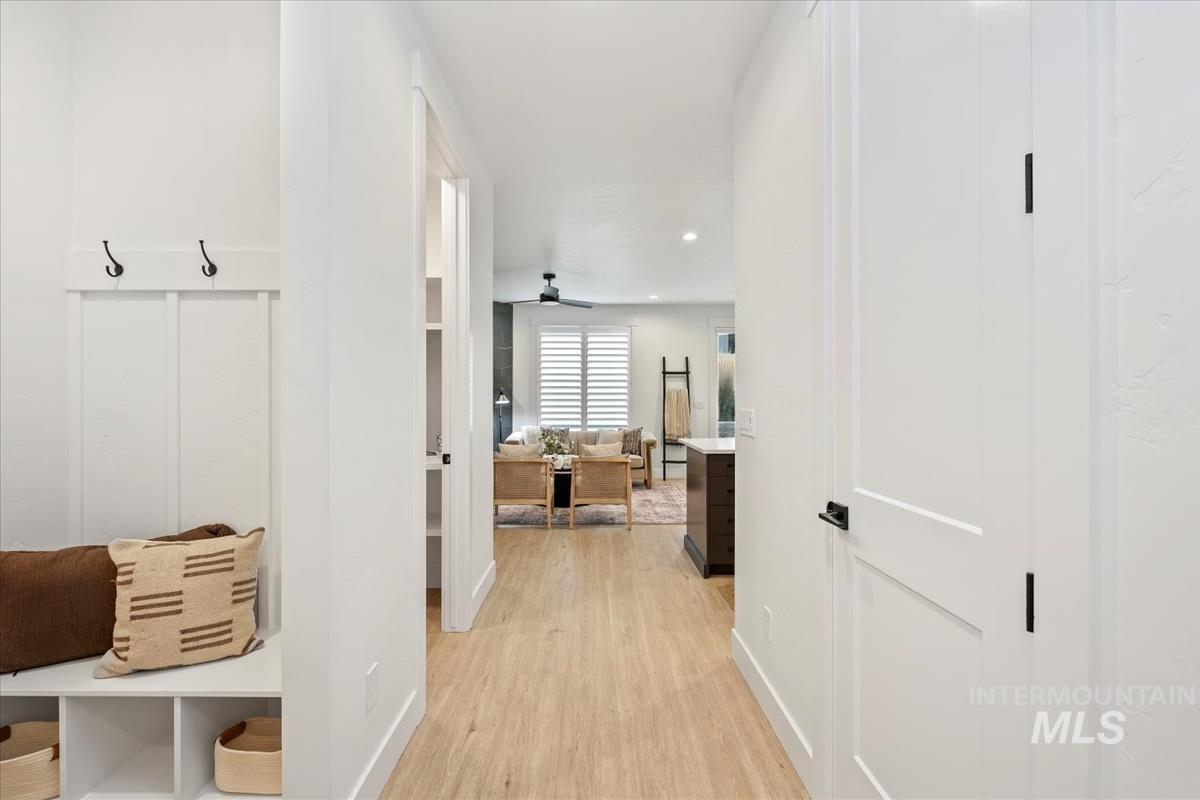 Mudroom featuring light wood-type flooring, ceiling fan, and recessed lighting