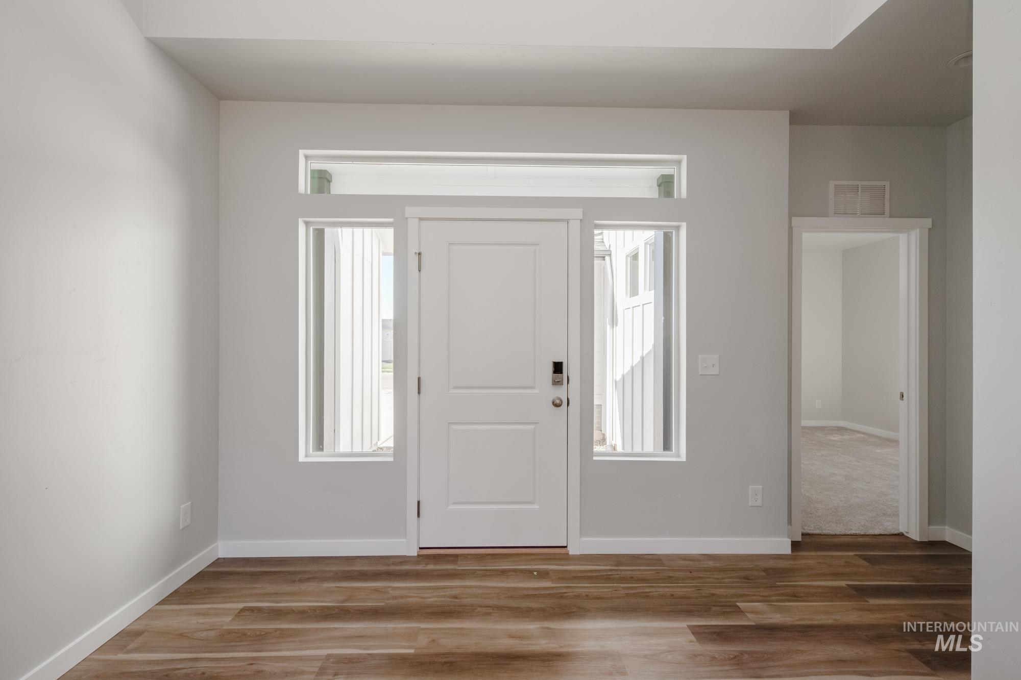 Foyer with wood finished floors