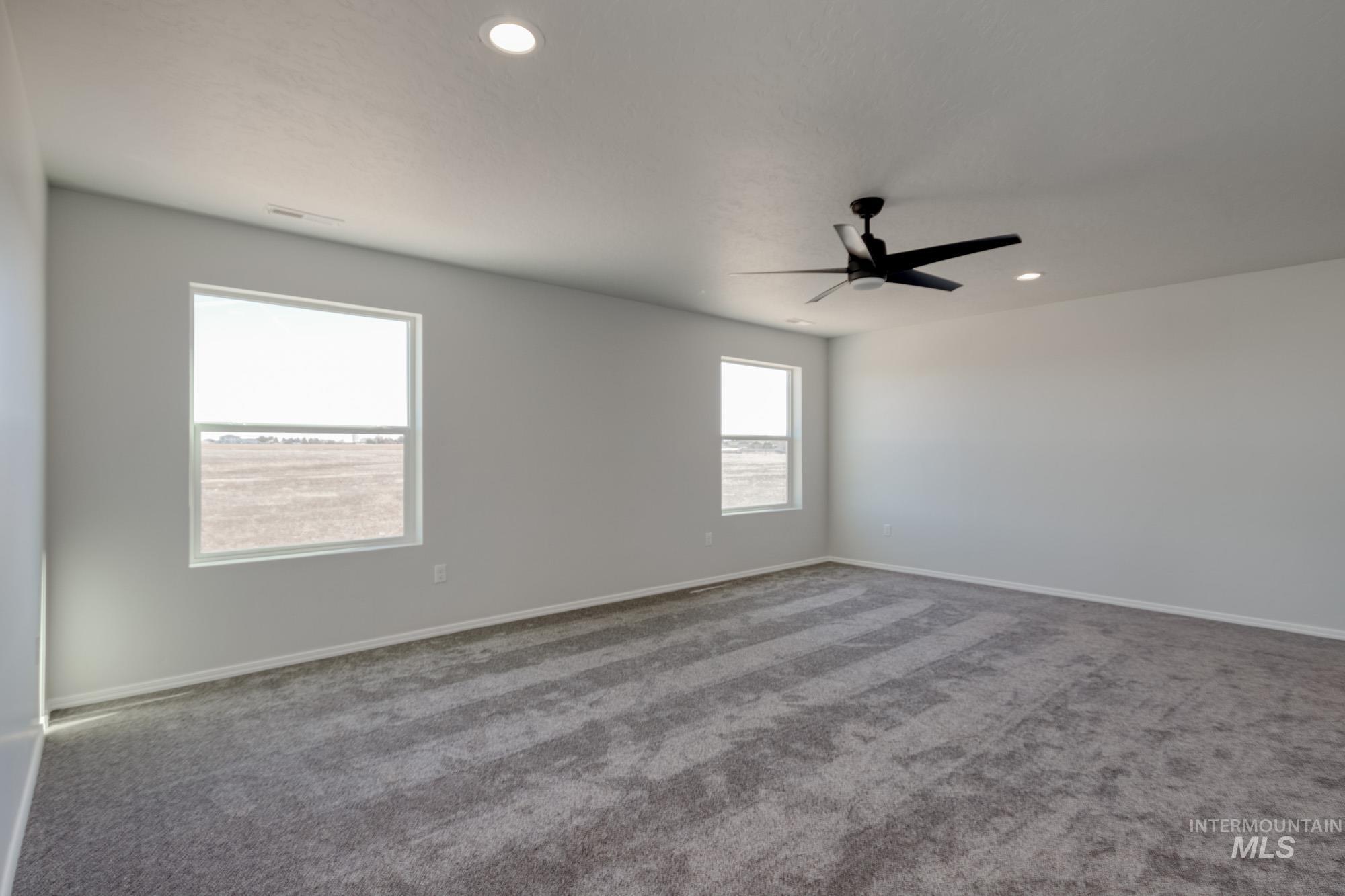Carpeted spare room with recessed lighting and ceiling fan