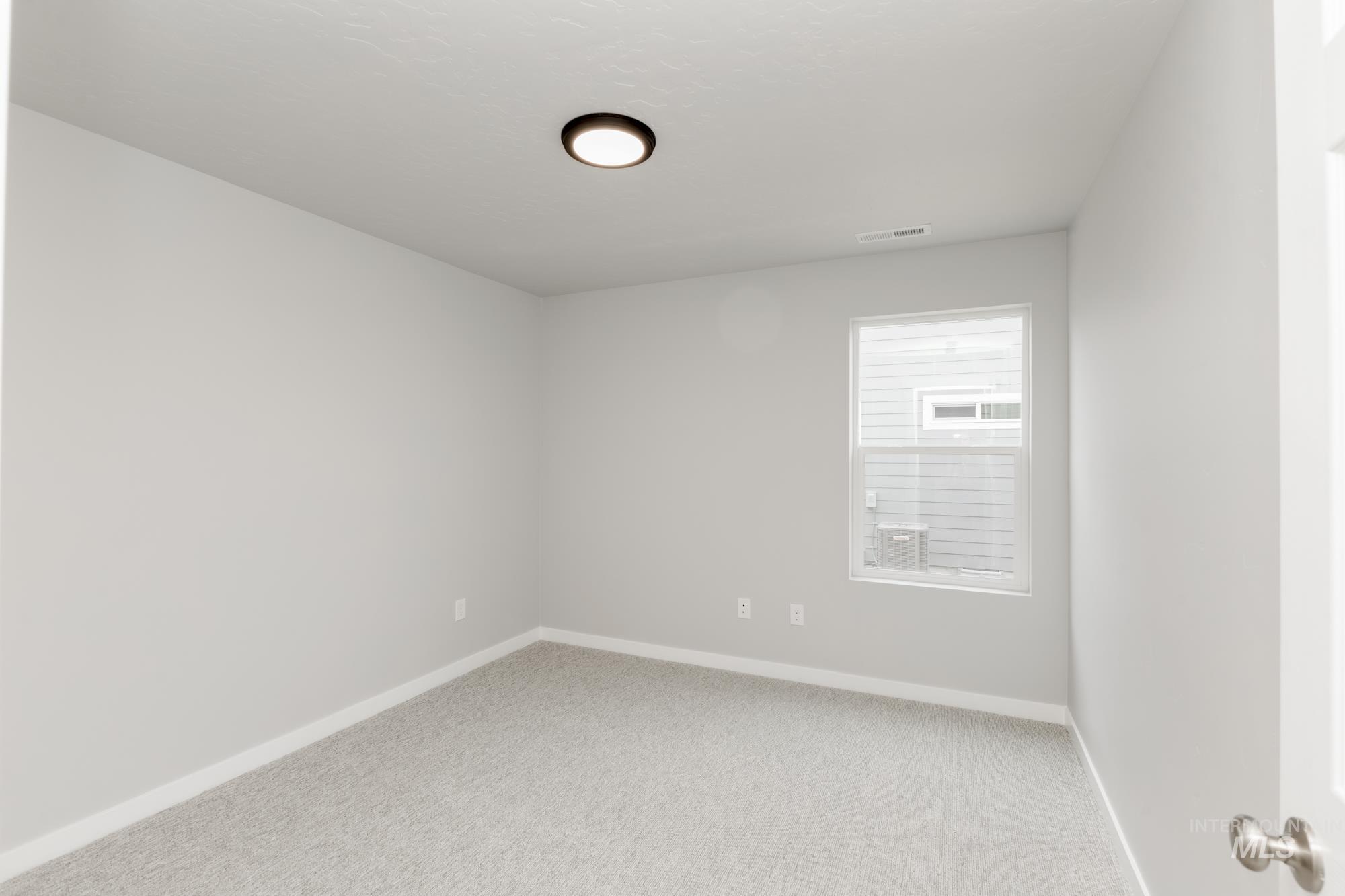 Empty room featuring carpet flooring