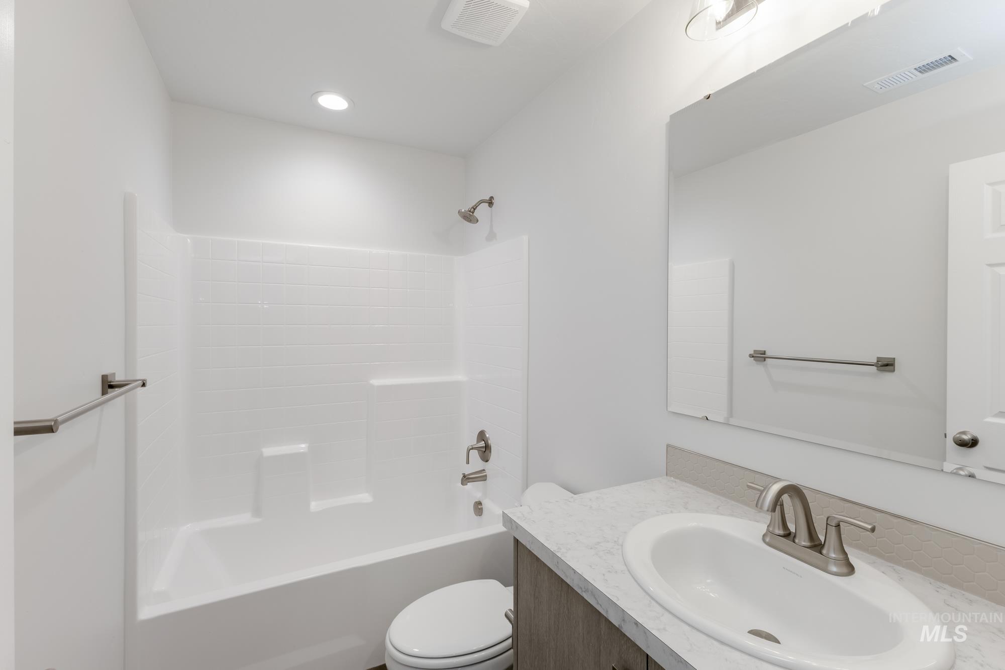 Bathroom with bathtub / shower combination and vanity
