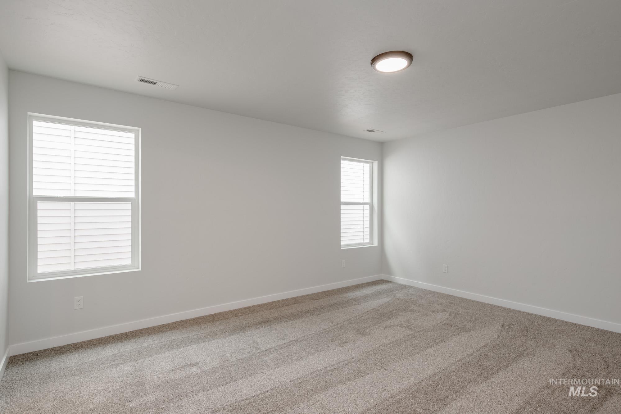 Unfurnished room featuring carpet flooring