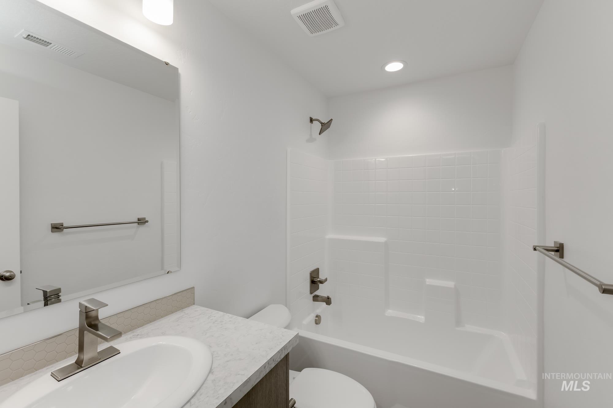 Full bath featuring vanity and tub / shower combination