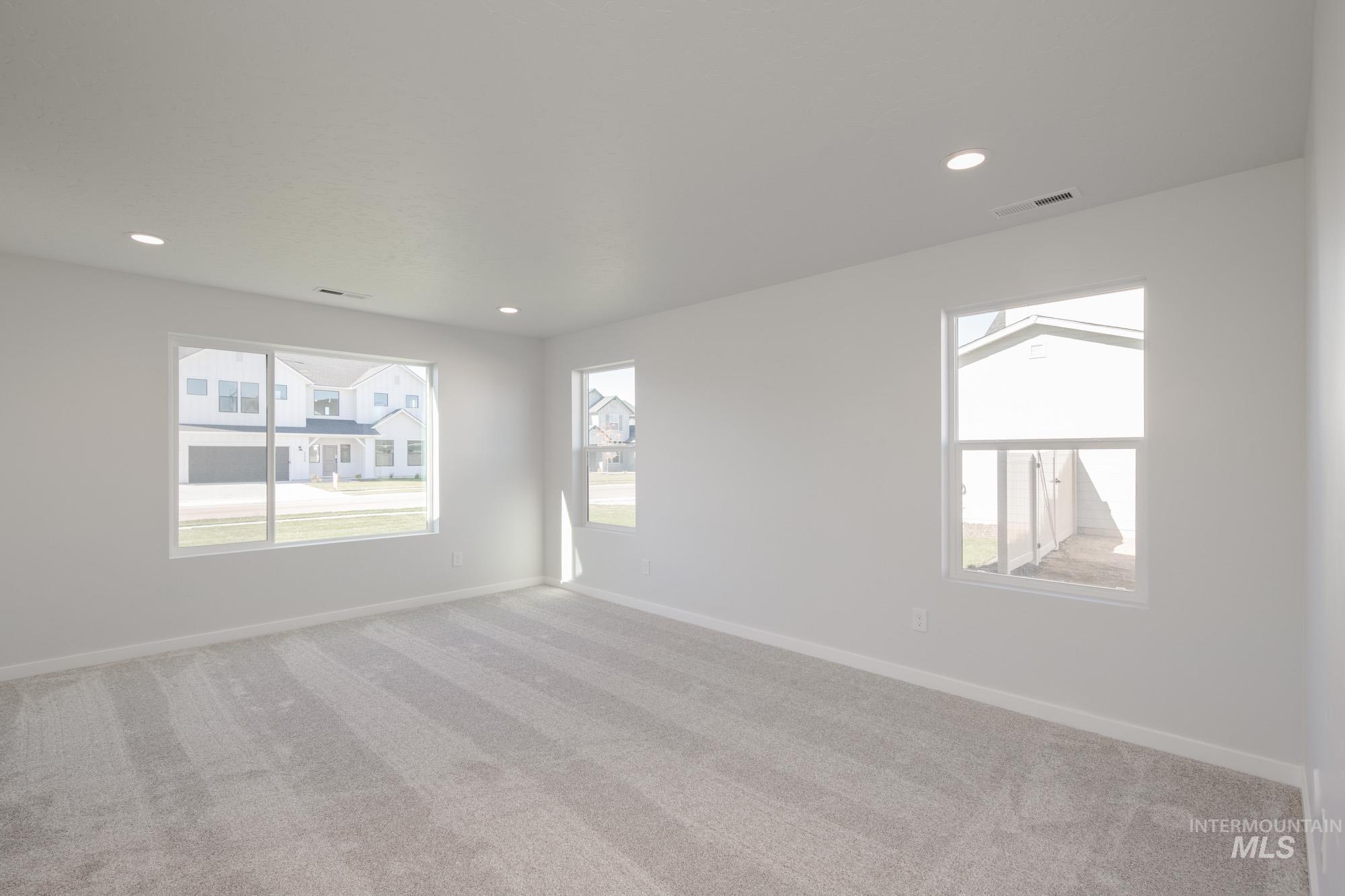 Unfurnished room featuring carpet floors and recessed lighting
