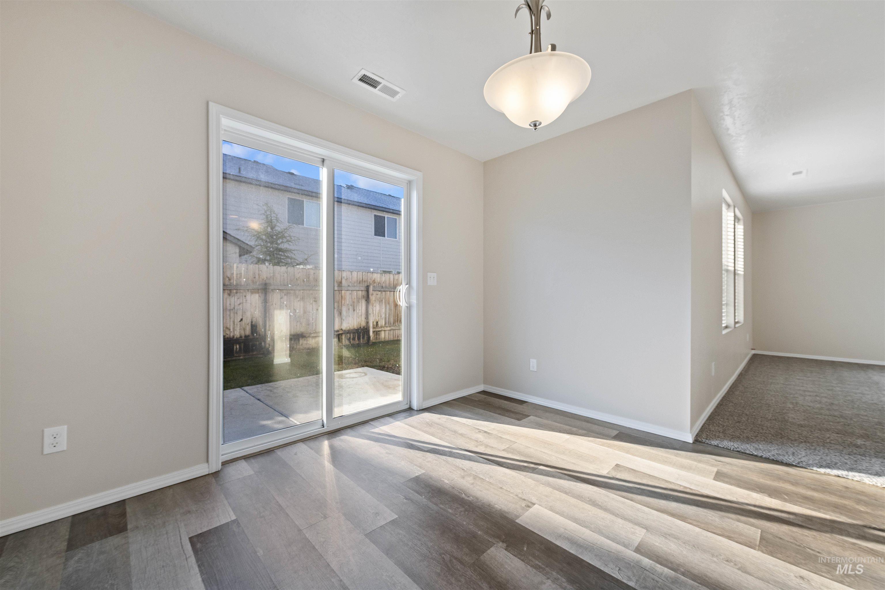 Unfurnished room with baseboards and light wood-style floors