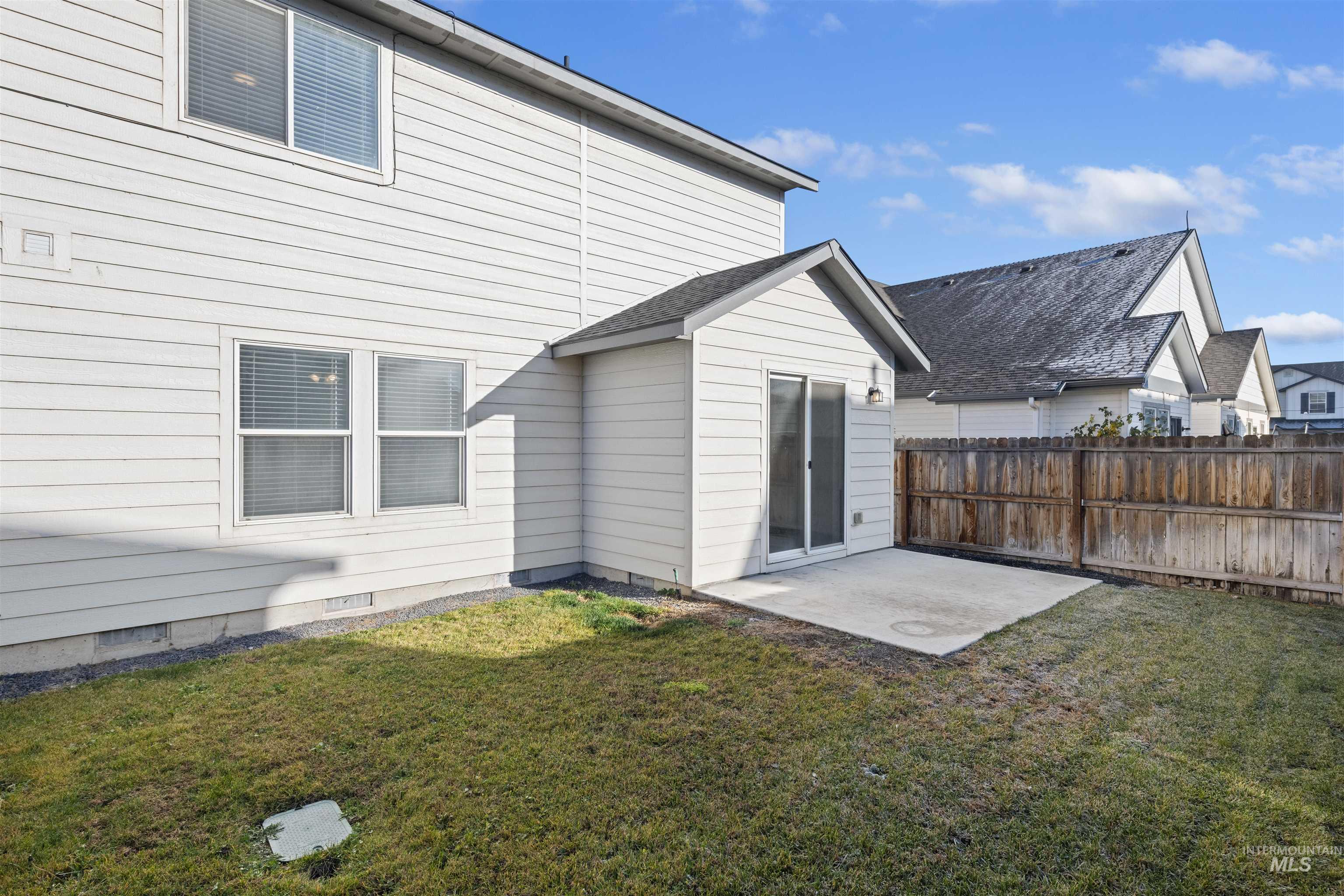 Back of house featuring a patio area and crawl space