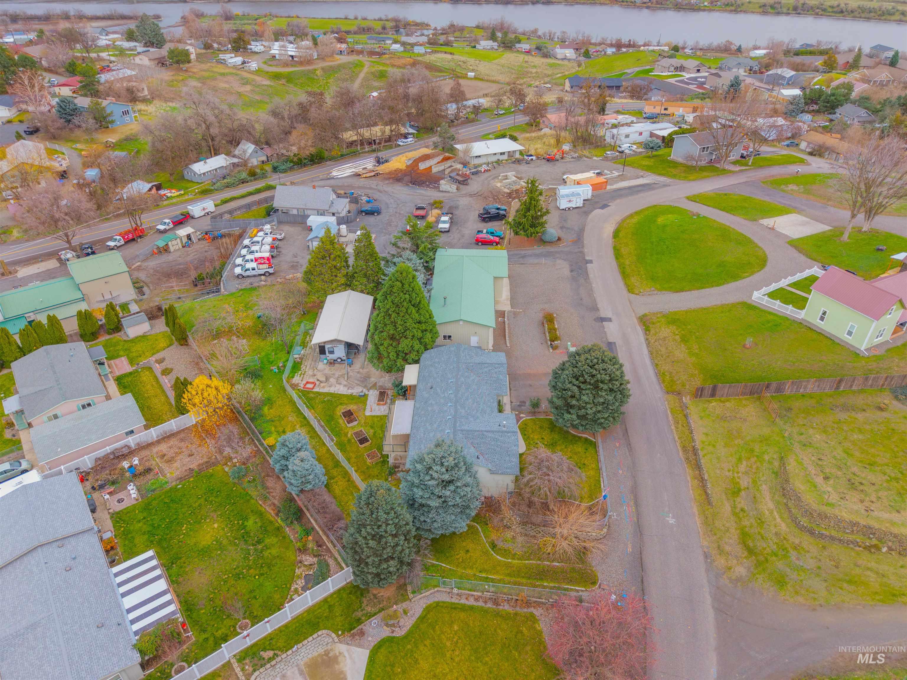 Aerial perspective of suburban area with a nearby body of water