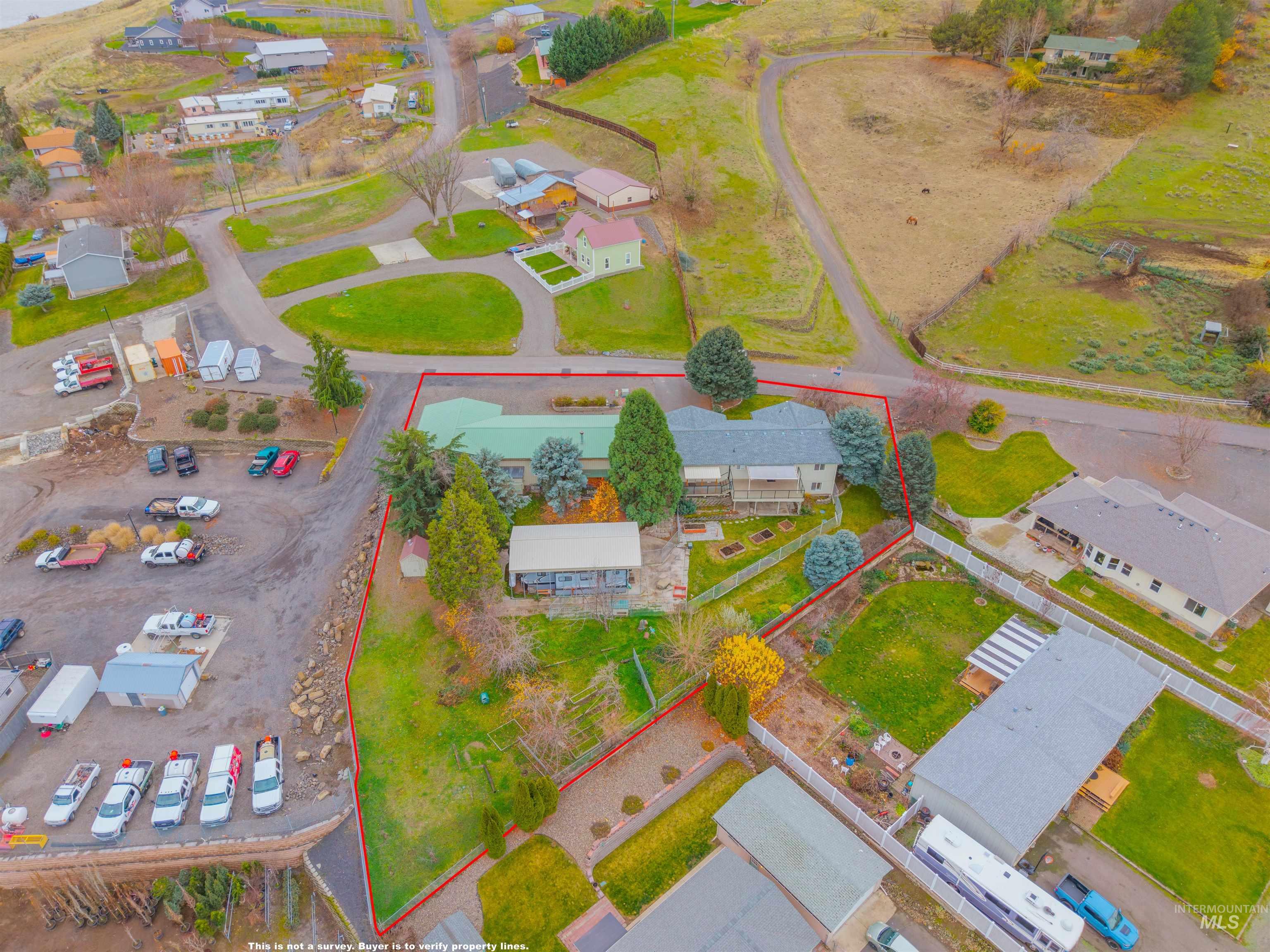 Aerial perspective of suburban area with property parcel outlined