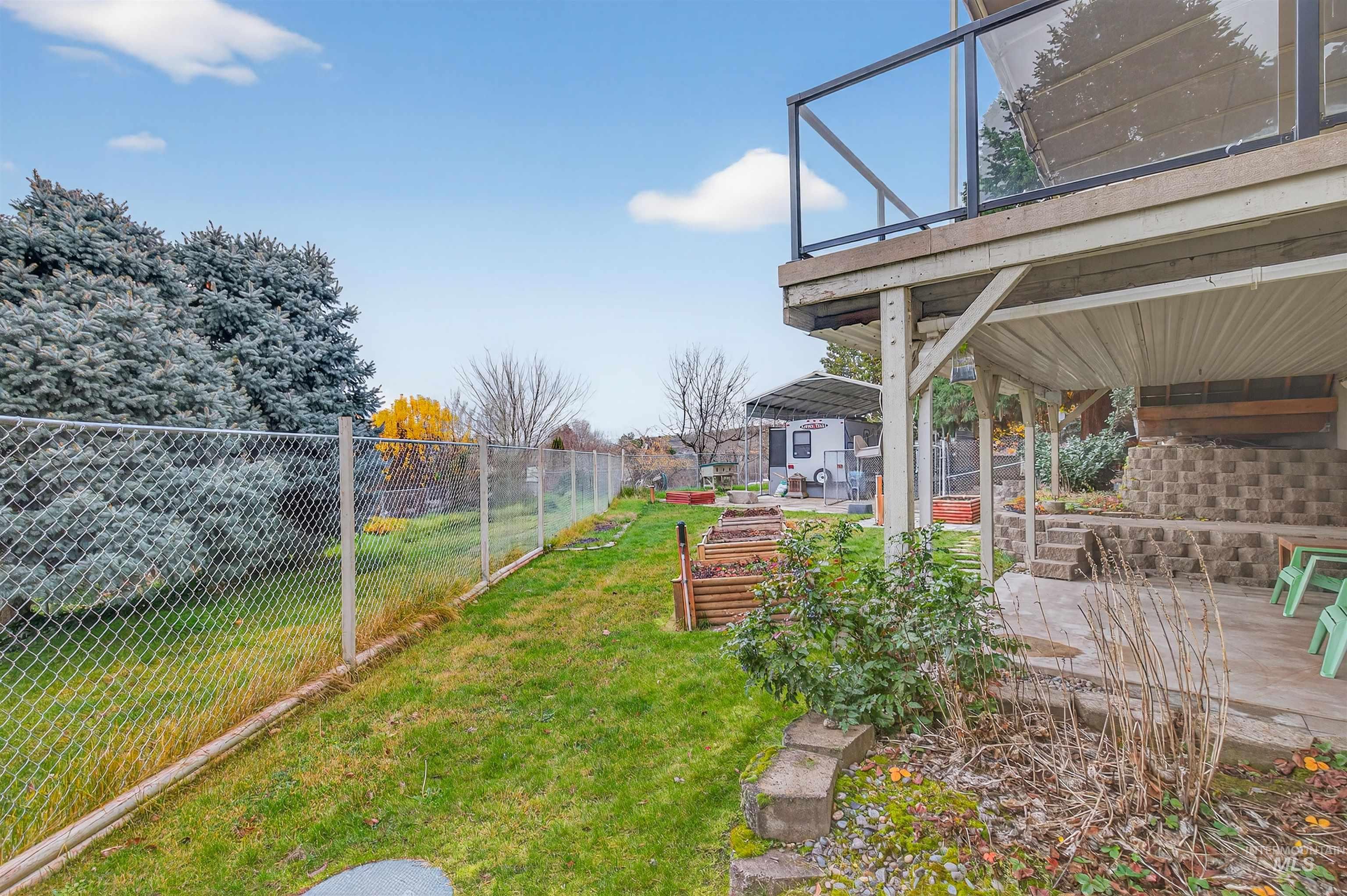 View of yard with a wooden deck