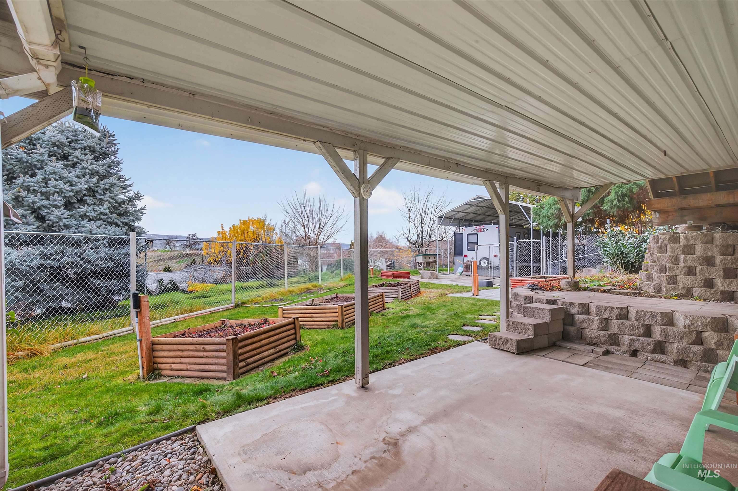 View of patio with a garden