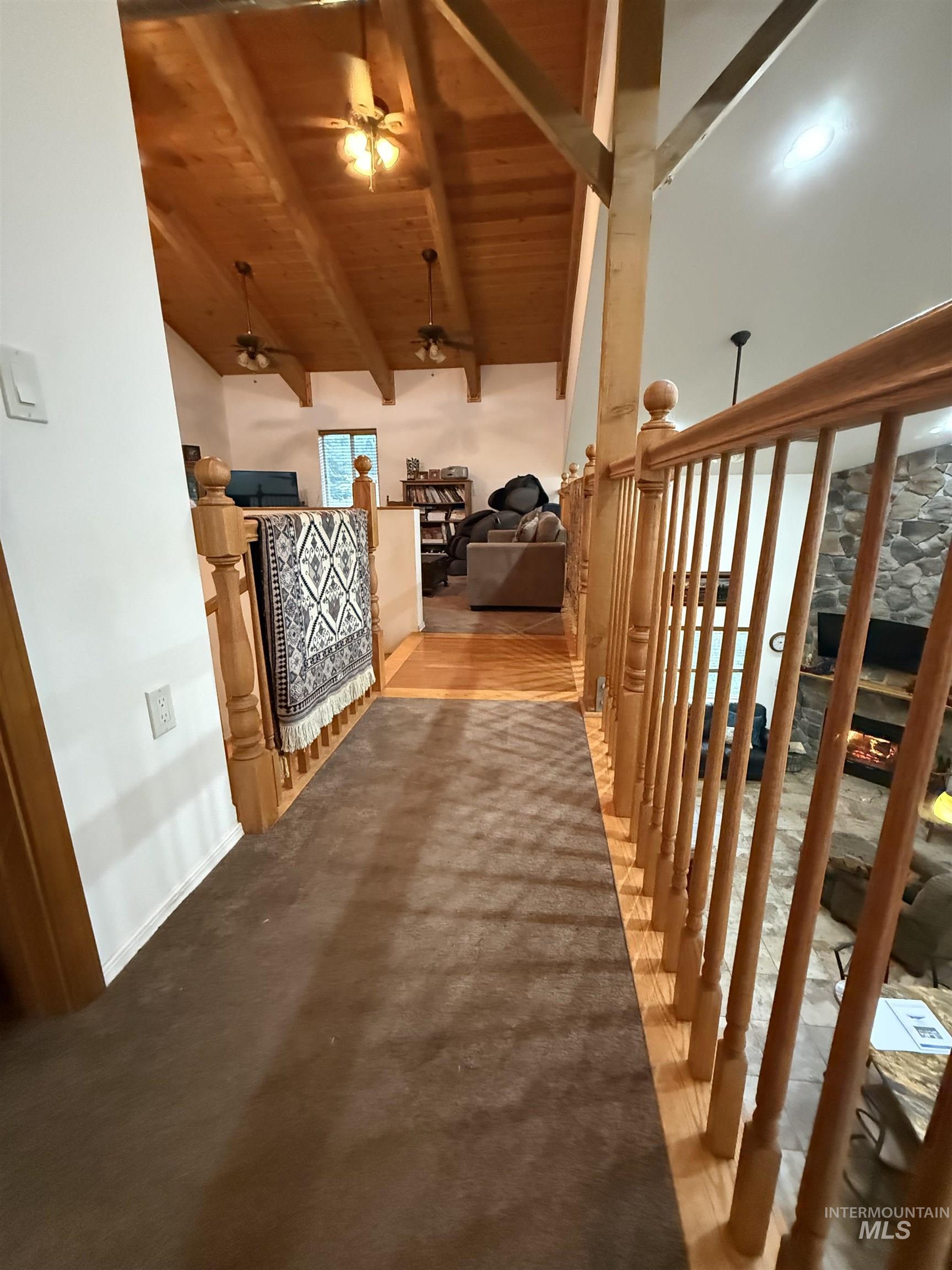 Hallway featuring wood ceiling and light wood-style floors