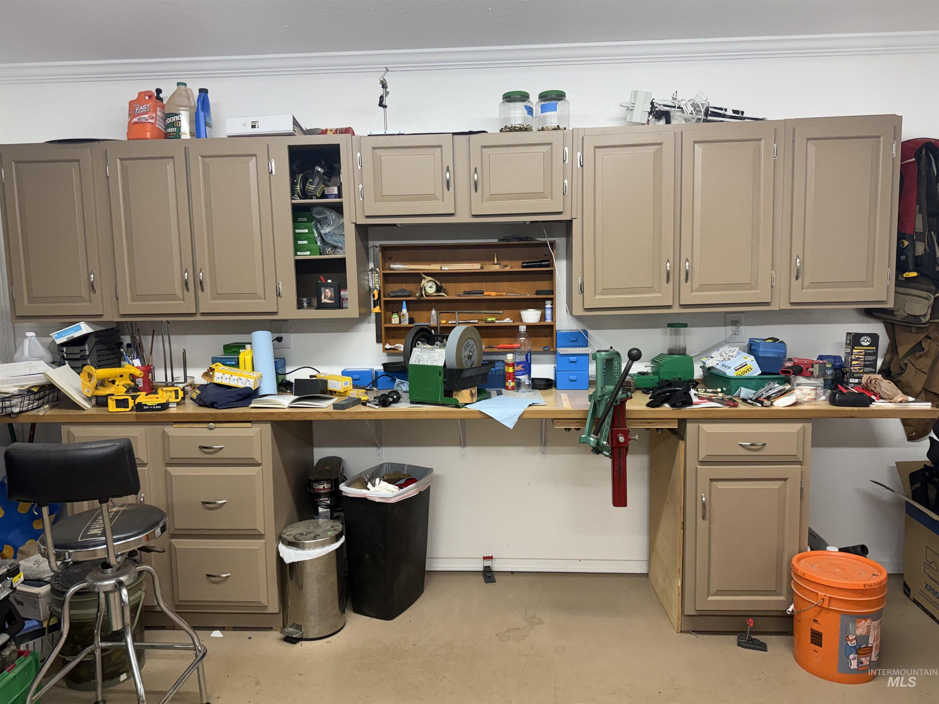 Kitchen with concrete floors and crown molding