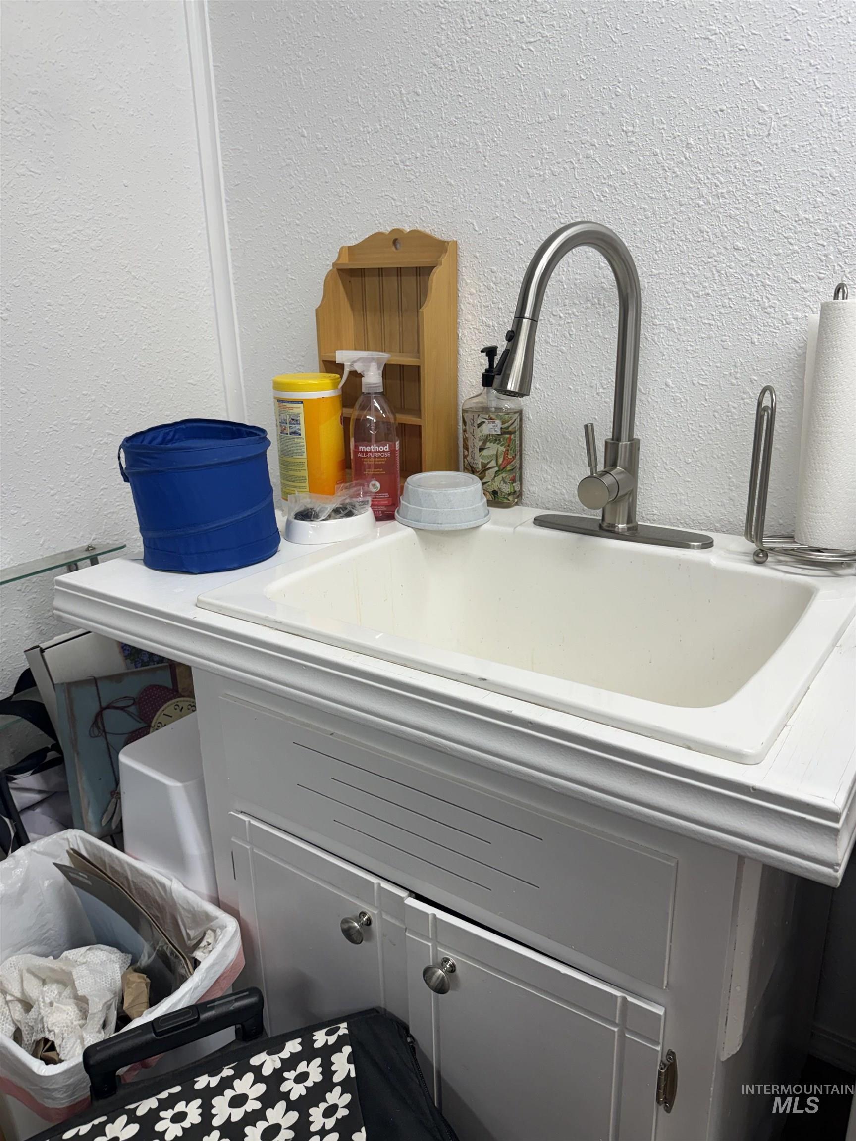 Detailed view of a textured wall and a sink