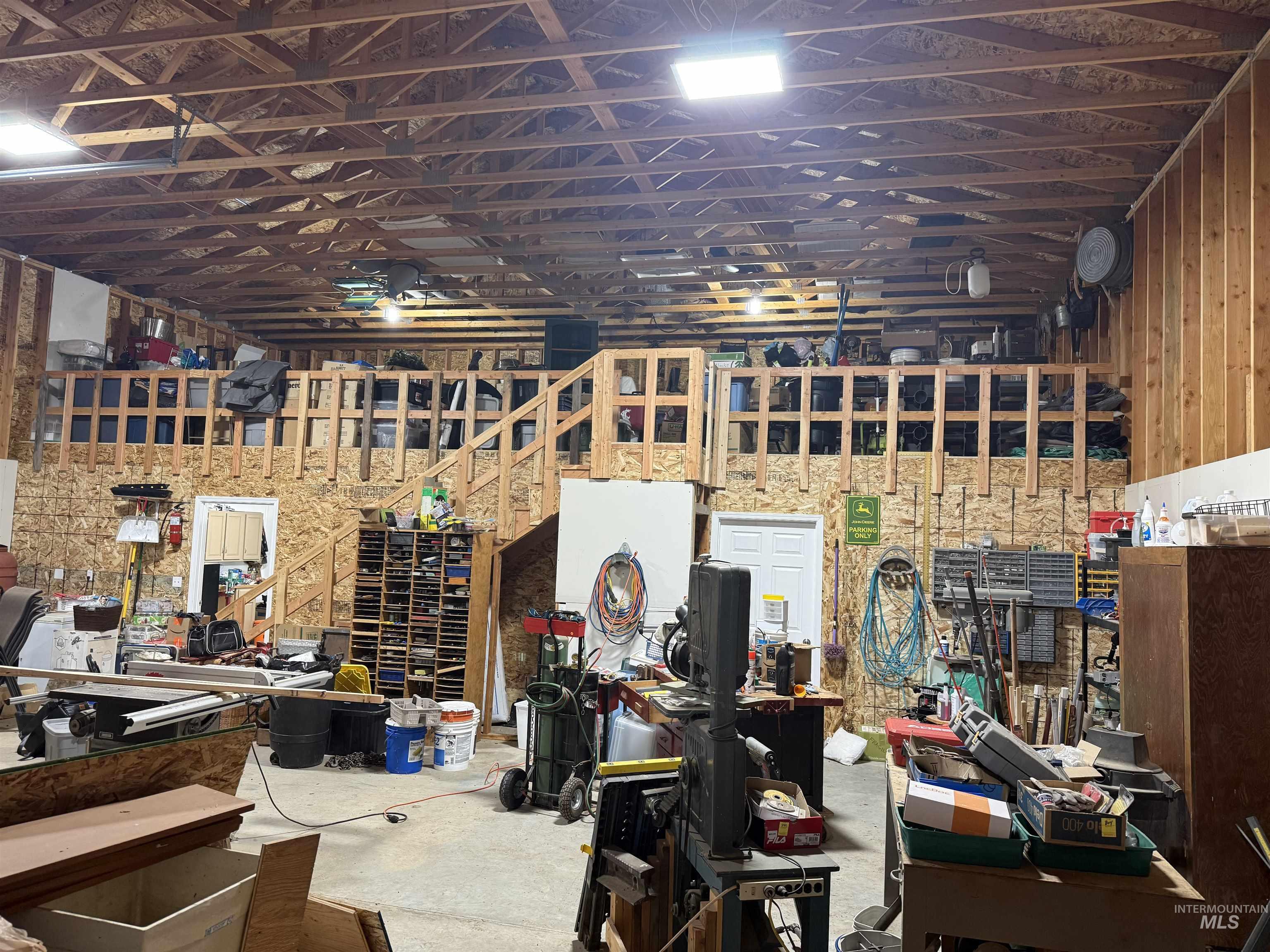 Misc room with a workshop area and unfinished concrete floors
