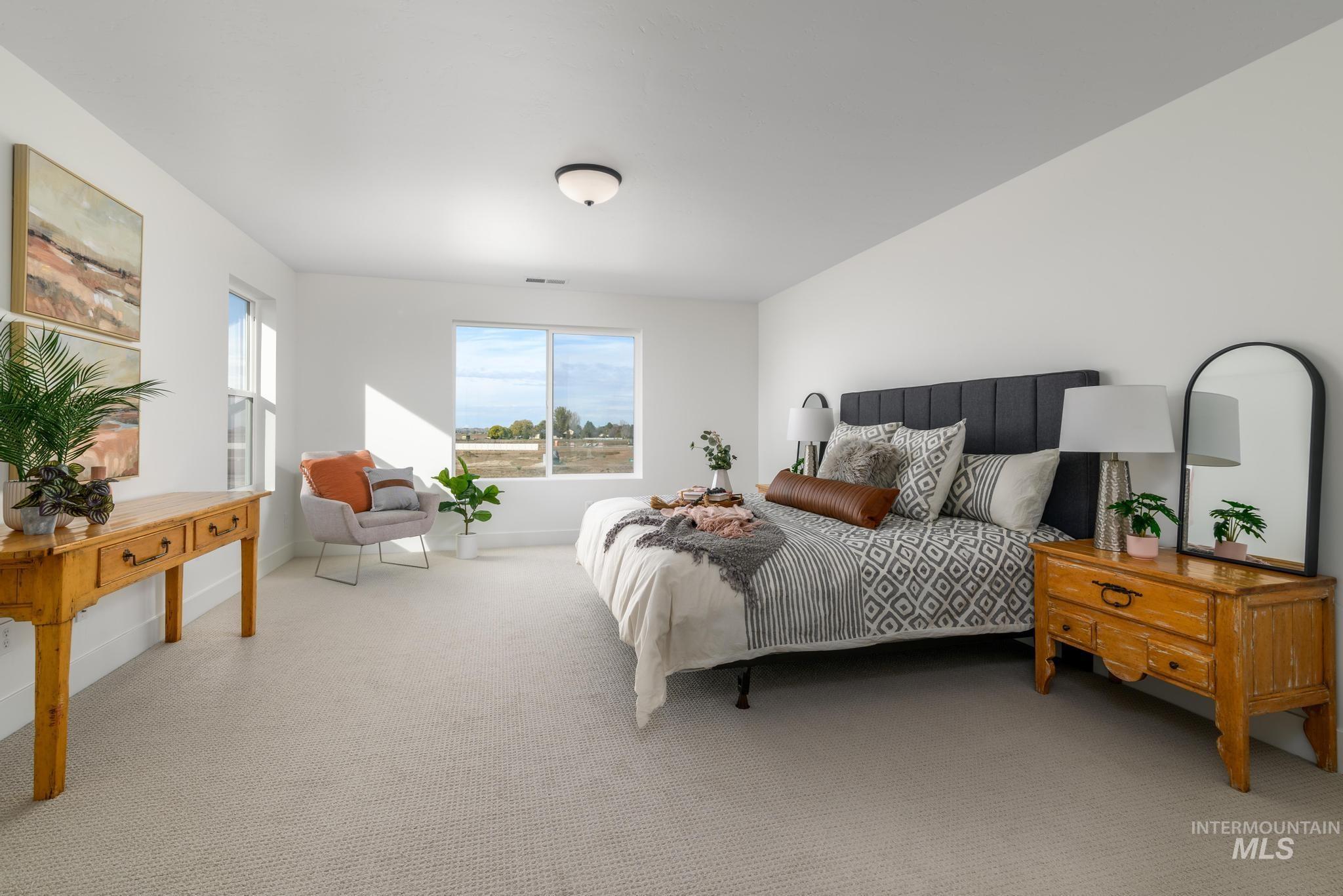 Carpeted bedroom featuring baseboards