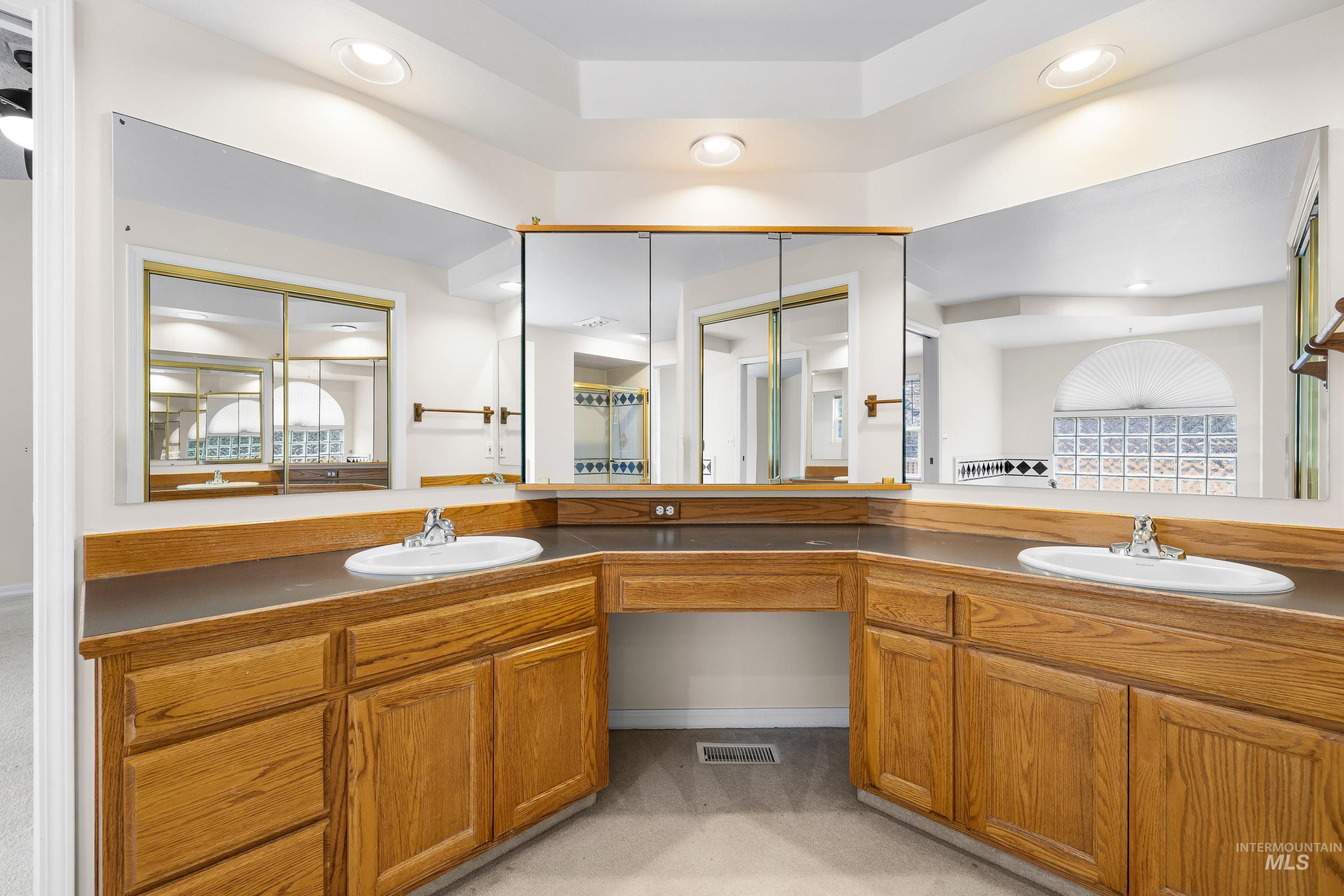 Bathroom featuring double vanity and recessed lighting