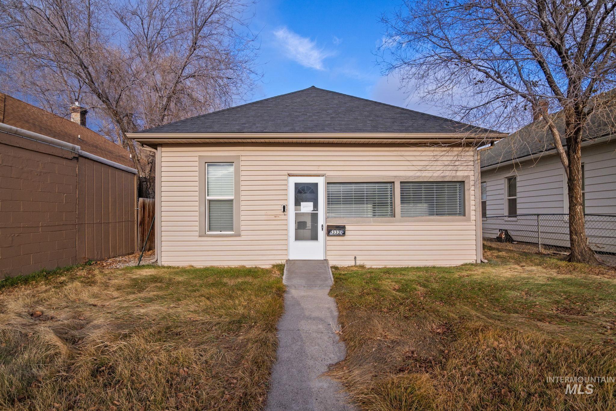 View of front facade with roof with shingles
