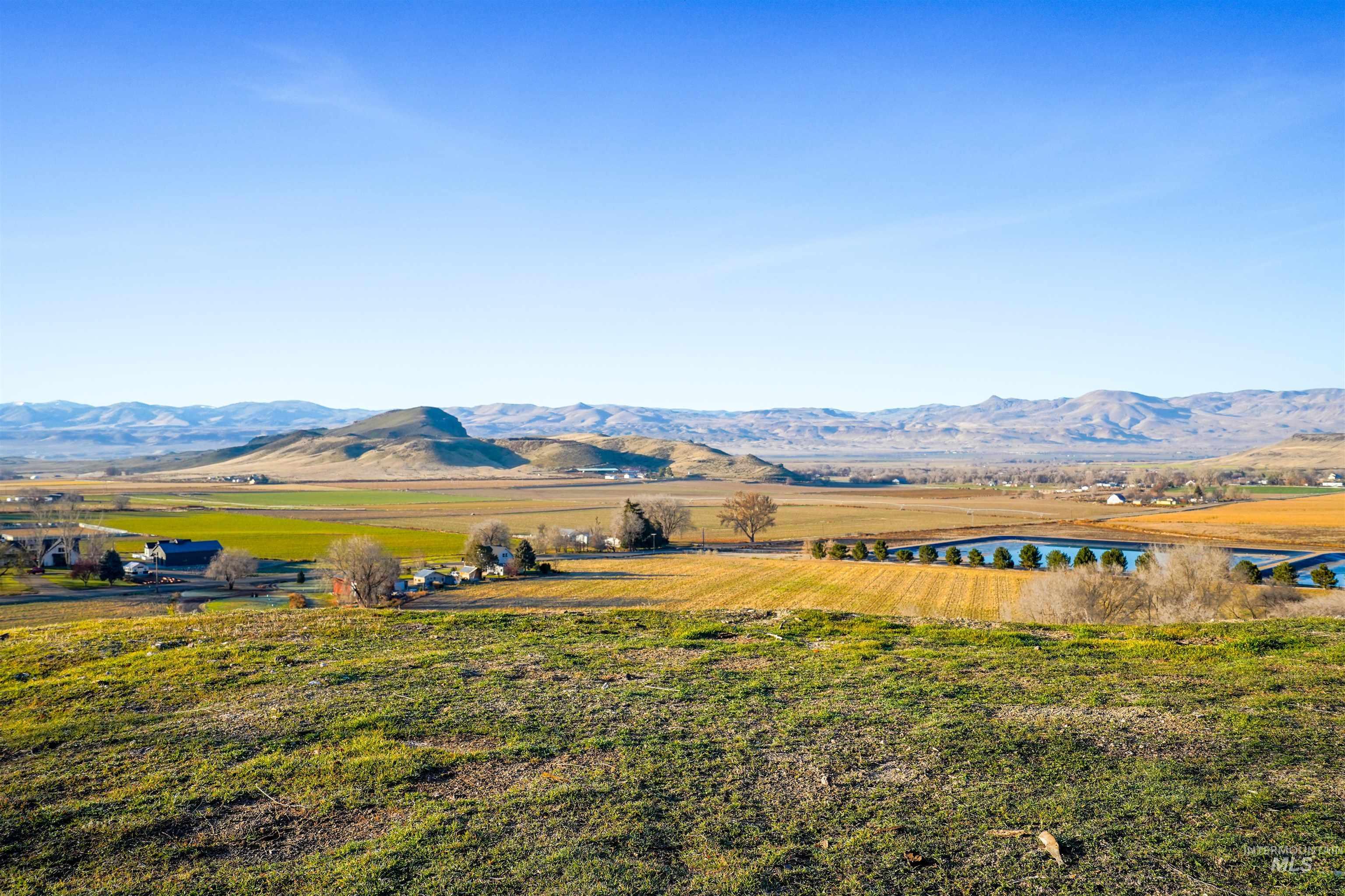 View of mountain background featuring rural landscape