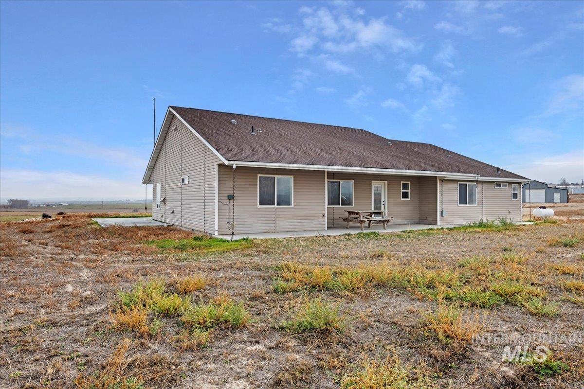 Rear view of property with a patio