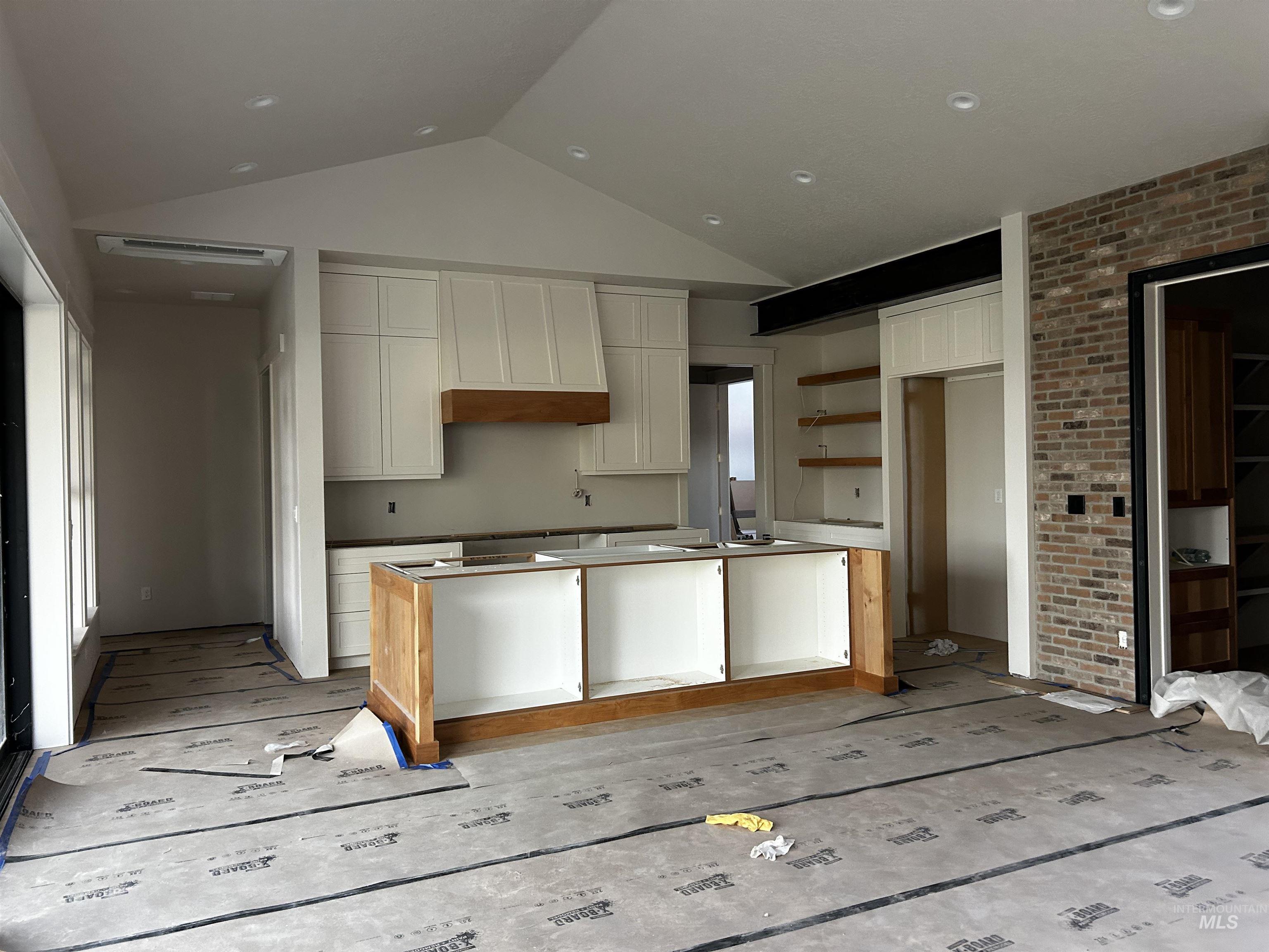 Kitchen as of first of December, custom cabinets, brick and hardwood flooring.