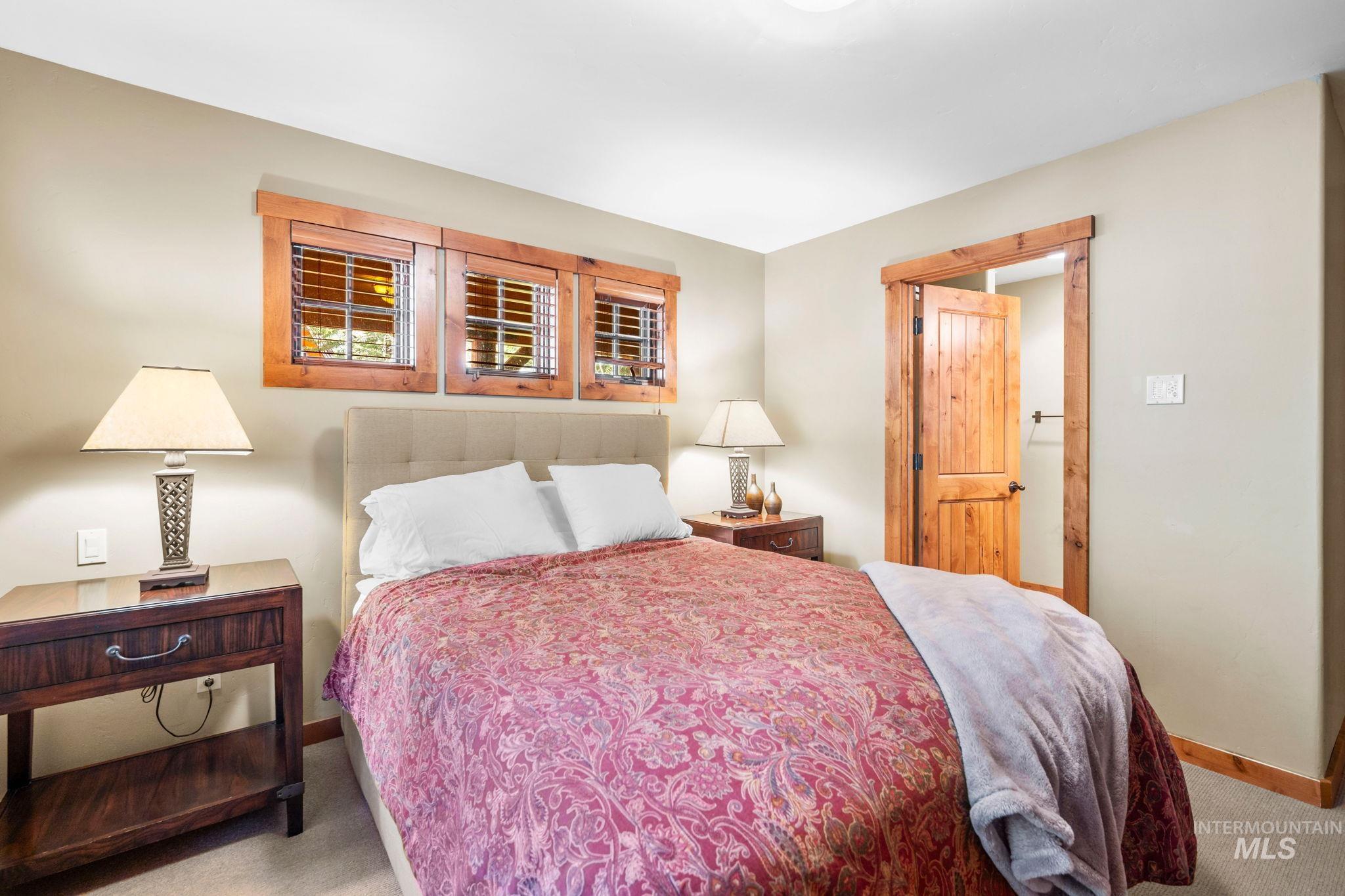 Carpeted bedroom with baseboards