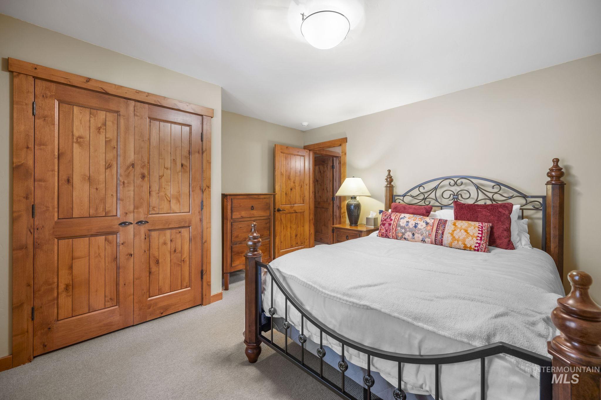 Bedroom featuring a closet and light colored carpet
