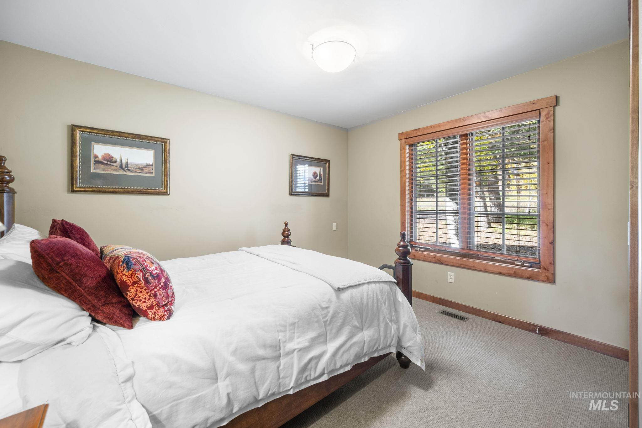 Bedroom with carpet and baseboards