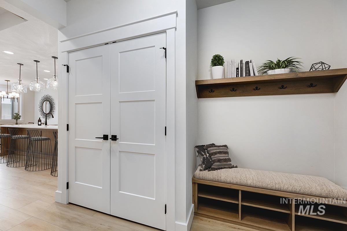 Mudroom featuring light wood-style flooring