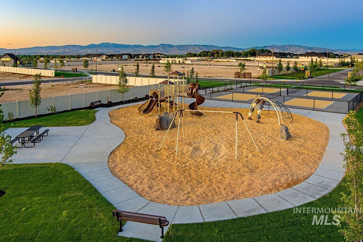 View of community featuring a mountain view and a patio area