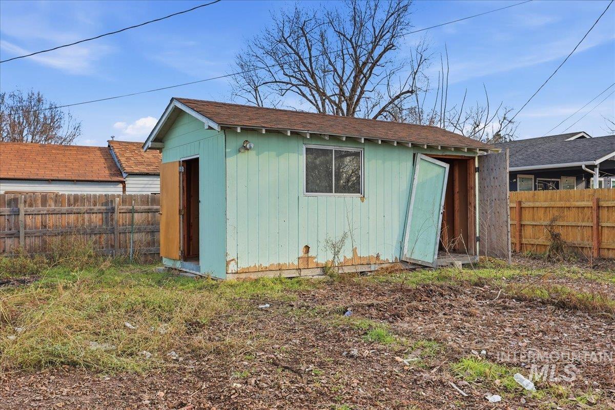 View of shed with a fenced backyard