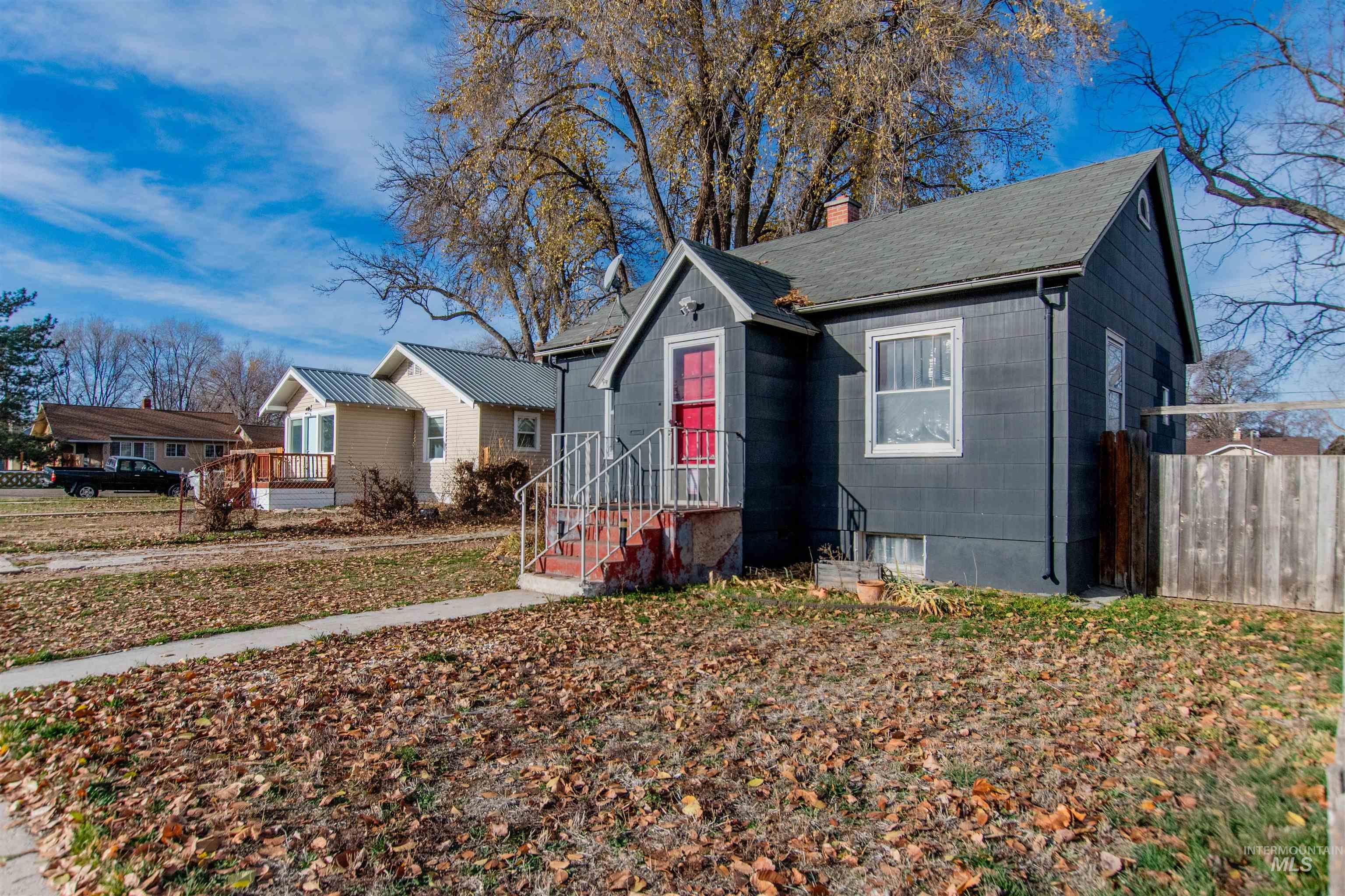 View of front of property with a chimney